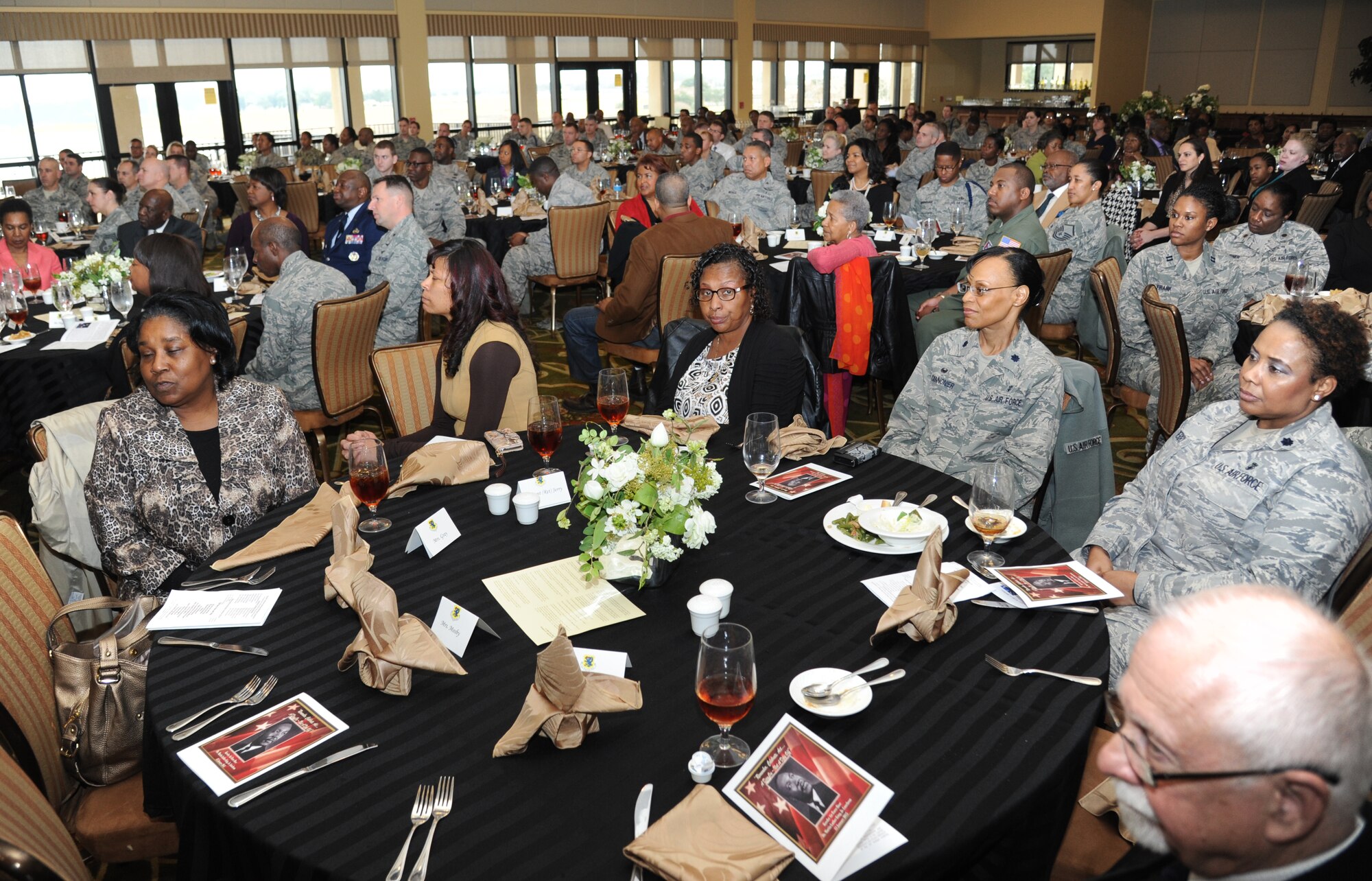 Guests listen to Maj. Gen. Mark Brown, 2nd Air Force commander, speak at the annual Dr. Martin Luther King Jr. Memorial Luncheon Jan. 13, 2015, at the Bay Breeze Event Center, Keesler Air Force Base, Miss. The Keesler African-American Heritage Committee sponsored the event. (U.S. Air Force photo by Kemberly Groue)
