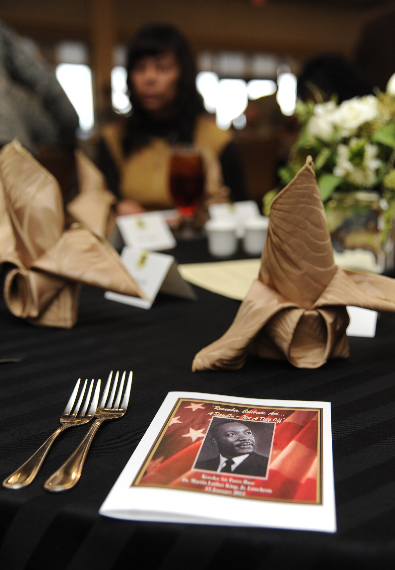 An event program sits on display for guests at the annual Dr. Martin Luther King Jr. Memorial Luncheon Jan. 13, 2015, at the Bay Breeze Event Center, Keesler Air Force Base, Miss. The guest speaker for the event was Maj. Gen. Mark Brown, 2nd Air Force commander. (U.S. Air Force photo by Kemberly Groue)