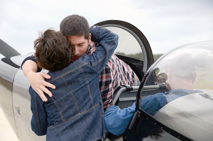 Marcy Voss greets Air Force Capt. Manuel Ochoa, who piloted her son’s plane, a Vans RV-8 experimental, single-engine aircraft just over 2,000 miles from Spokane, Wash., to Boerne Air Field in Boerne, Texas, Dec. 12.
Photo by L.A. Shively