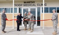 (From left) Curtis Aberle, McWethy Troop Medical Clinic chief; Brig. Gen. Barbara Holcomb, commander of Southern Regional Medical Command; Col. Carol Rymer, Optometry Service chief; and Col. Evan Renz, Brooke Army Medical Center commander, cut the ribbon officially reopening McWethy Troop Medical Clinic Jan. 6 after a 16-month, $13 million renovation.
Photo by Robert Shields