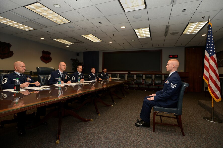 U.S. Air Force Staff Sgt. James Springer, 20th Medical Group Alcohol and Drug Prevention and Treatment NCO in charge, sits at the position of attention while appearing before a 20th Fighter Wing annual awards board, Jan. 15, 2015 at Shaw Air Force Base, S.C. Springer along with other top NCOs, competed against each other for 20th FW NCO of the year. Each nominee appeared before the board which was made up of six chief master sergeants from units within the 20th FW and was led by CMSgt. Charles Mills, 20th Fighter Wing command chief. All nominees where asked two specific and opinionated questions from each board member, which were designed to be objective and allowed the opportunity to talk about the subject, thus evaluating communication skills. After all nominees were evaluated, board members discussed any major differences based on scoring criteria to determine who is the best of the best. (U.S. Air Force photo by Staff Sgt. Kenny Holston/Released)