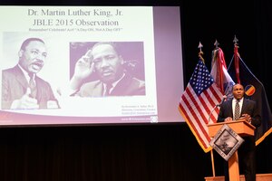 Retired U.S. Army Col. Dr. Krewasky Salter, speaks during a Martin Luther King, Jr. memorial ceremony at Fort Eustis, Va., Jan. 13, 2015. Salter read excerpts from King’s book, “Why we can’t wait” and summarized King’s views on pushing forward toward a goal of equality. (U.S. Air Force photo by Staff Sgt. Teresa J. Cleveland/Released)
