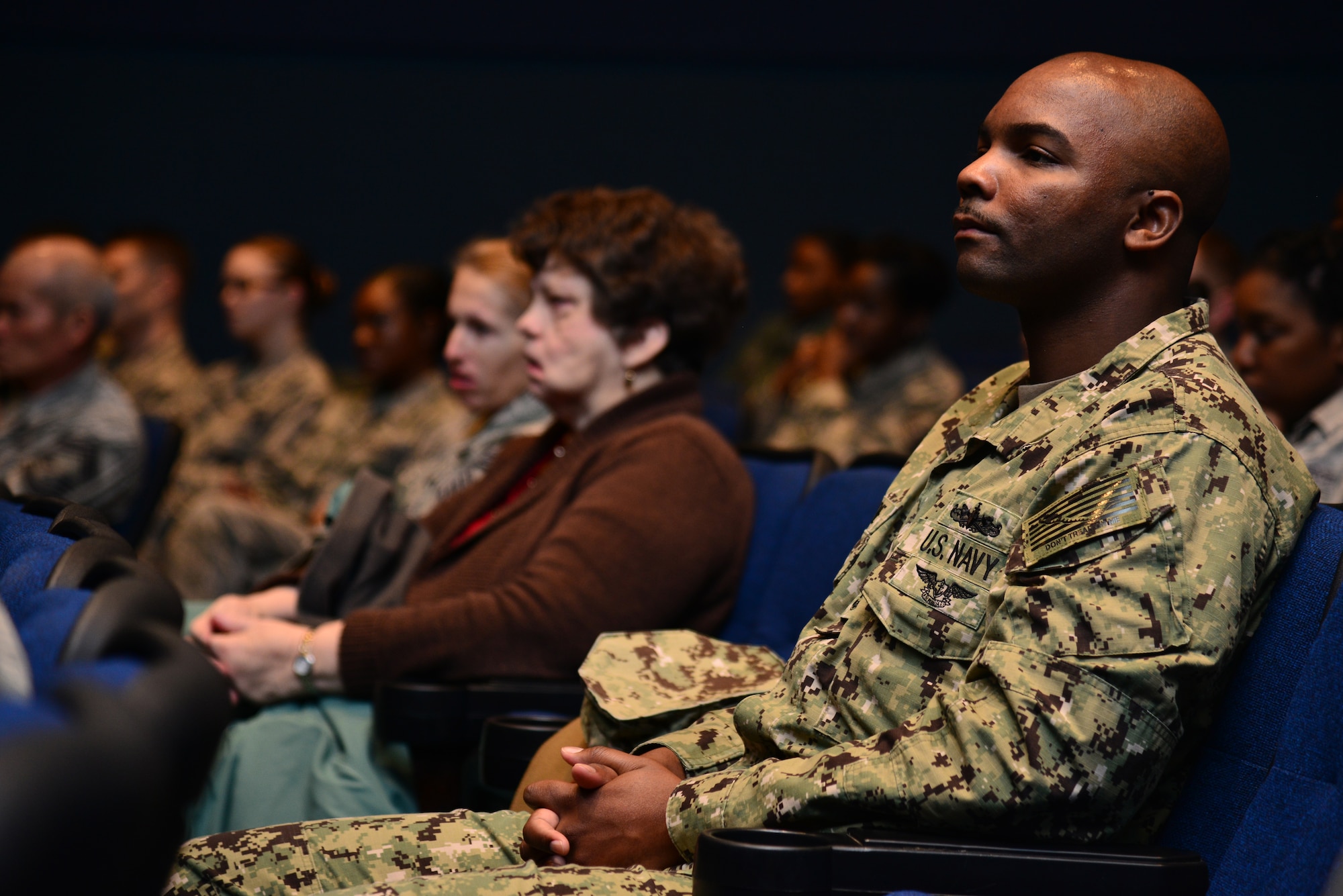 Members of Joint Base Langley-Eustis listen to a reading of Rev. Dr. Martin Luther King, Jr.’s “I Have a Dream” at Langley Air Force Base, Va., Jan. 15, 2015. The Langley African American Heritage Council hosted the in event in celebration of King’s legacy. (U.S. Air Force photo by Senior Airman Aubrey White/Released)