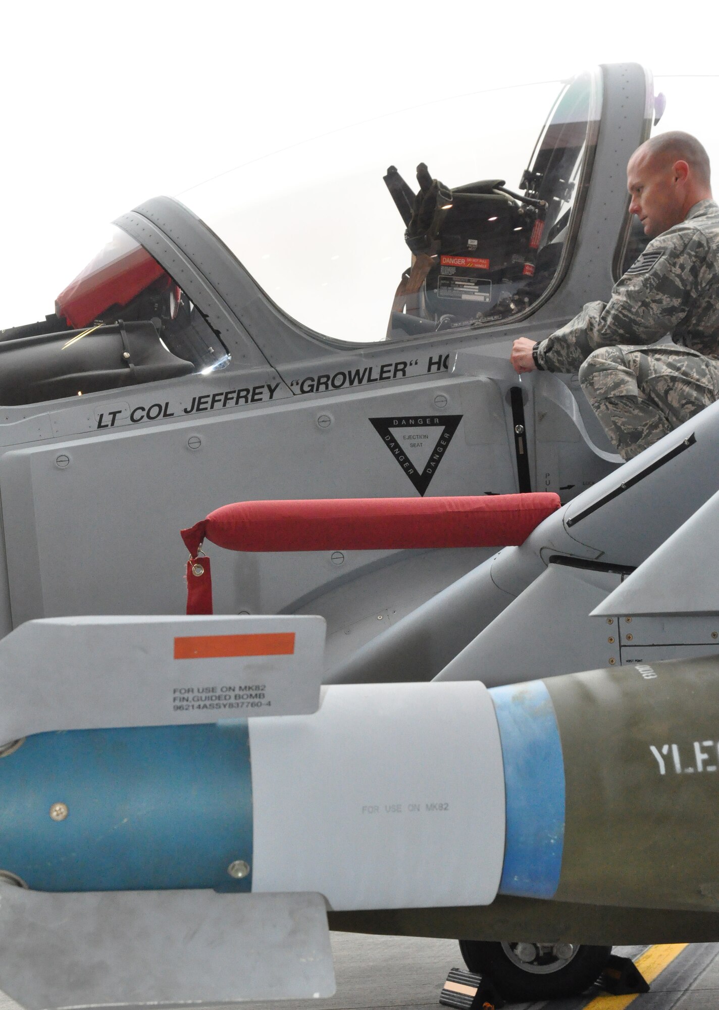 Lt. Col. Jeffrey "Growler" Hogan's name is unveiled on the side of an A-29 Super Tucano. Hogan is the newest commander of the 81st Fighter Squadron, which will train Afghan pilots and maintainers at Moody Air Force Base, Ga., through 2018. The A-29 is a light air support training aircraft that will be used to train 30 Afghan pilots and 90 Afghan maintainers as part of a requirement from the International Security Assistance Force to conduct training outside of Afghanistan. The need for the A-29 comes as the current Afghan Air Force LAS aircraft, the Mi-35 attack helicopter, reaches the end of its service life in January 2016. (U.S. Air Force photo by Airman 1st Class Ceaira Tinsley/Released)
