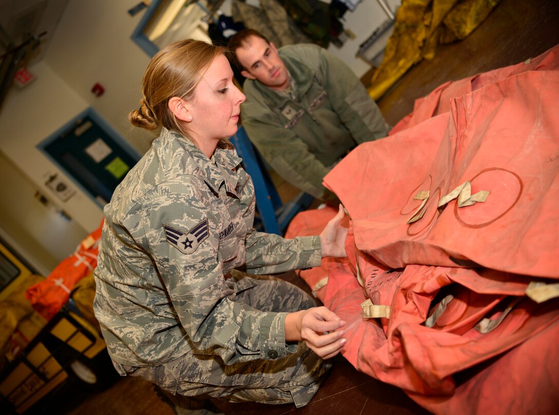 Senior Airman Joy Neuenschwander, 914th Operation Support Squadron, repacks a 20 man life raft after completing an annual inspection, January 11, 2015. Senior 
Airman Neuenschwander is the 914th Airlift Wing Spotlight performer for the month of January. (U.S. Air Force photo by Staff Sgt. Stephanie Sawyer) 