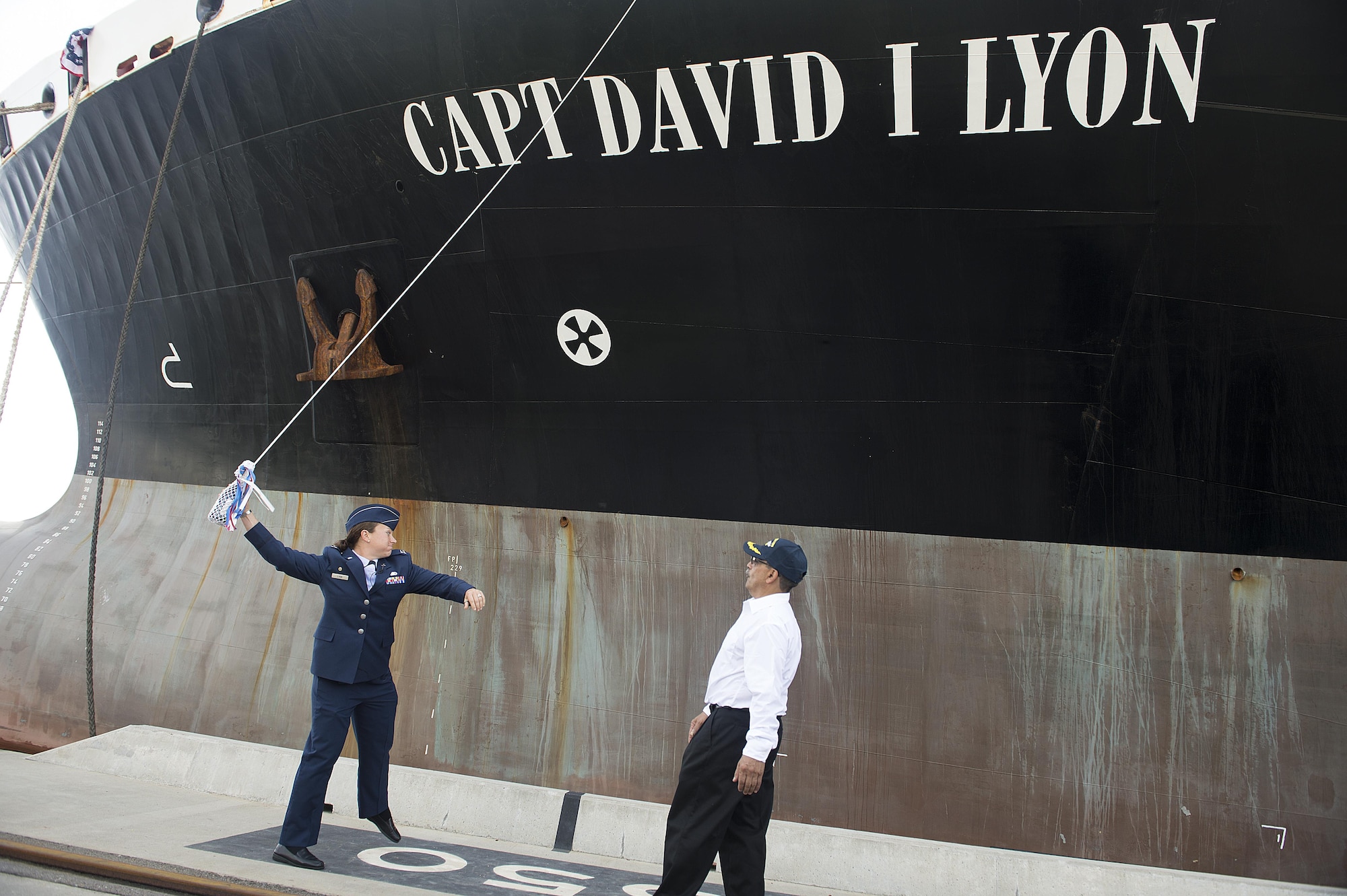 Capt. Dana M. Lyon, widow of Capt. David I. Lyon, prepares to break a champagne bottle on the hull of the Motor Vessel Capt. David I. Lyon during a christening and ship visit, Aug. 11, 2014, at Military Ocean Terminal Sunny Point, Southport, N.C. The MV Capt. David I. Lyon is an Air Force prepositioning vessel named in honor of Capt. David I. Lyon, an Air Force logistics readiness officer and 2008 U.S. Air Force Academy graduate who was killed in action Dec. 27, 2013, in Afghanistan. The vessel will transport critical war reserve materiel to locations around the globe. (U.S. Air Force photo/Tech. Sgt. Jason Robertson) 