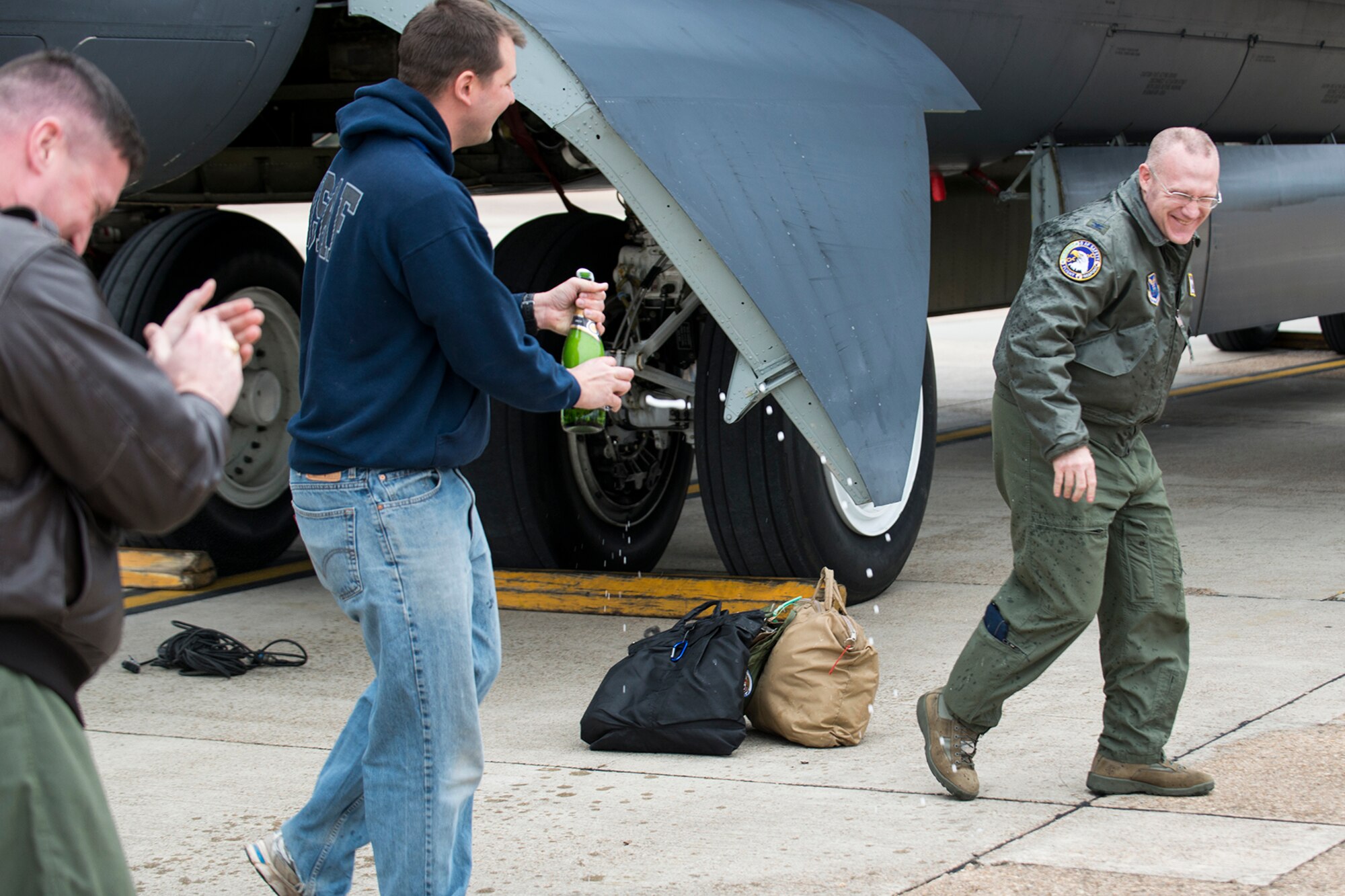 U.S. Air Force Col. Michael Adderley, Air Force Global Strike Command chief of safety, gets a champagne welcome after returning from a mission on Jan. 10, 2015, at Barksdale Air Force Base, La. Adderley flew his last sortie in a B-52H Stratofortress with members of the 307th Bomb Wing’s 343rd Bomb Squadron before retiring after serving more than 20 years in the military. (U.S. Air Force photo by Master Sgt. Greg Steele) (U.S. Air Force photo by Master Sgt. Greg Steele/Released)