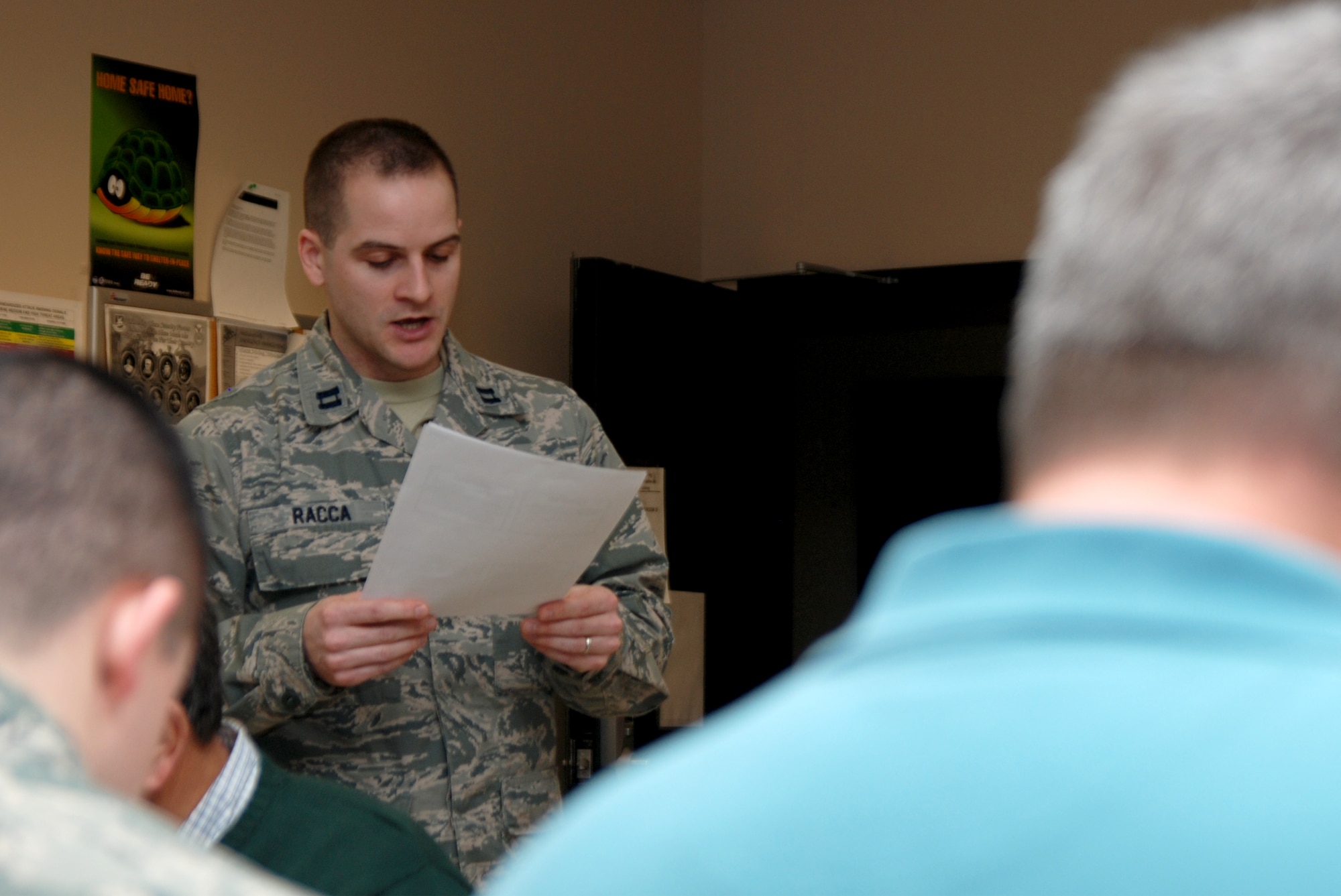 Chap. (Capt.) Justin Racca, 22nd Air Refueling Wing Individual Mobility Augmentee chaplain provides fellowship during the Chapel’s Lunch and Learn, Jan. 13, 2015, at McConnell Air Force Base, Kan. The weekly event has moved to the 931st Security Forces Squadron training room in building 1185 while the base Chapel is closed for a six-month renovation. (U.S. Air Force photo/Master Sgt. Leigh Bellinger)