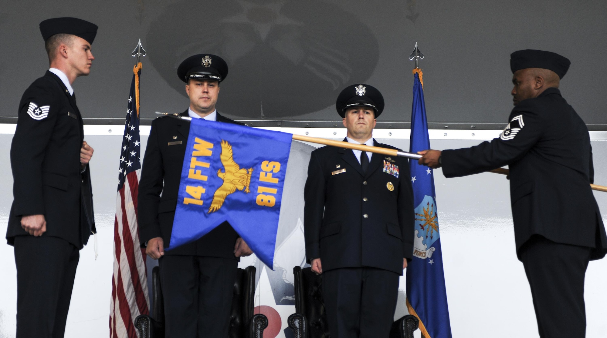 The 81st Fighter Squadron guidon is unfurled Jan. 15, 2015, at Moody Air Force Base, Ga., officially reactivating the squadron.  The unit traces its lineage back to the 81st Pursuit Squadron (Interceptor), which was originally activated on Jan. 15, 1942.  The 81st FS will train Afghan student pilots and maintainers as part of the light air support training mission. (U.S. Air Force photo by Senior Airman Sandra Marrero/Released)
