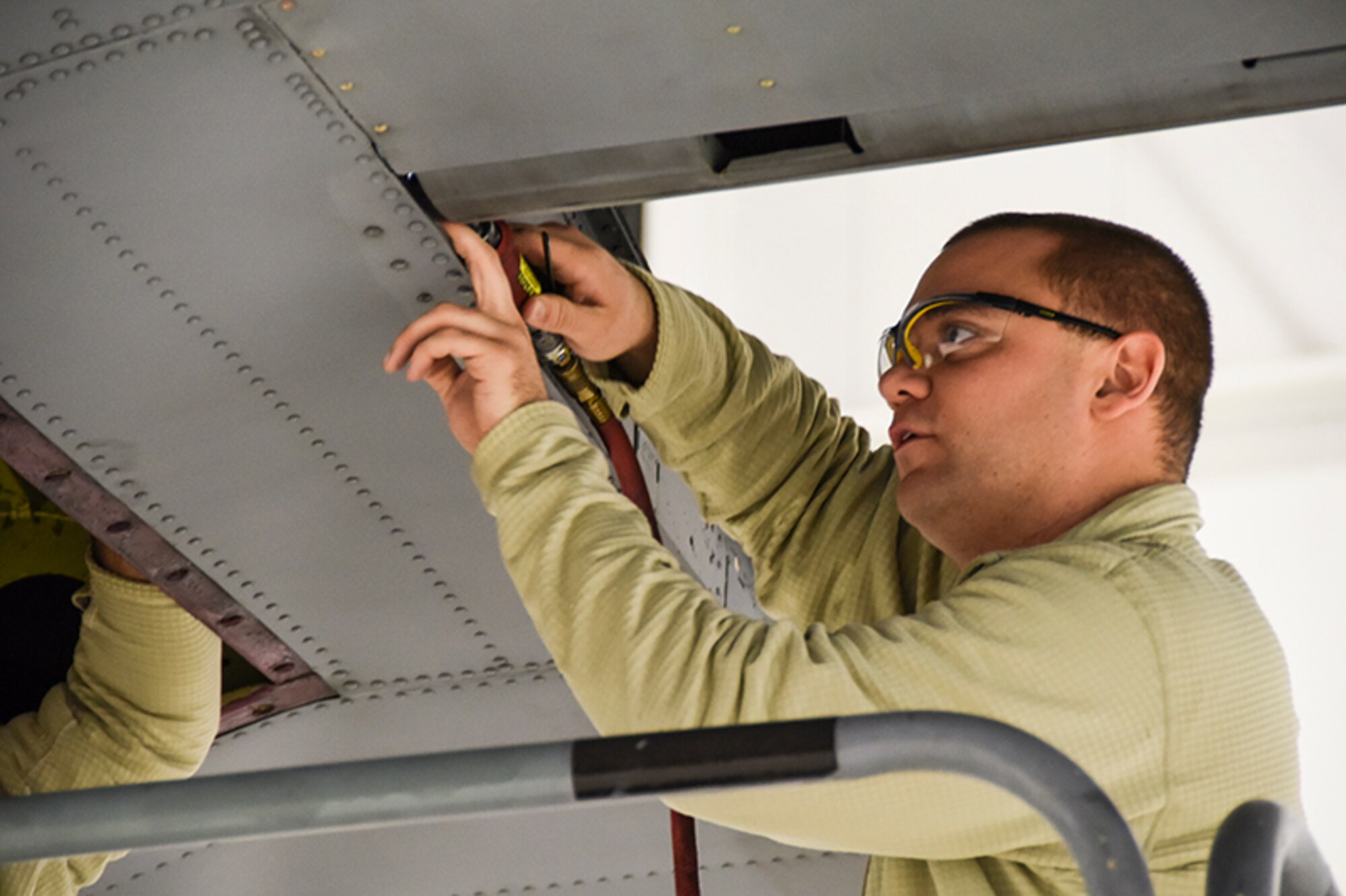 Staff Sgt. Dave Clark, 911th Maintenance Squadron structural mechanic, replaces a corroded L-angle on the back tail of a C-130 Hercules, Jan. 10, 2015, at Pittsburgh International Airport Air Reserve Station. Spot checking the C-130’s for corrosion is a necessary safety inspection that results in 100 percent accountability for the Airmen assigned to the aircraft.