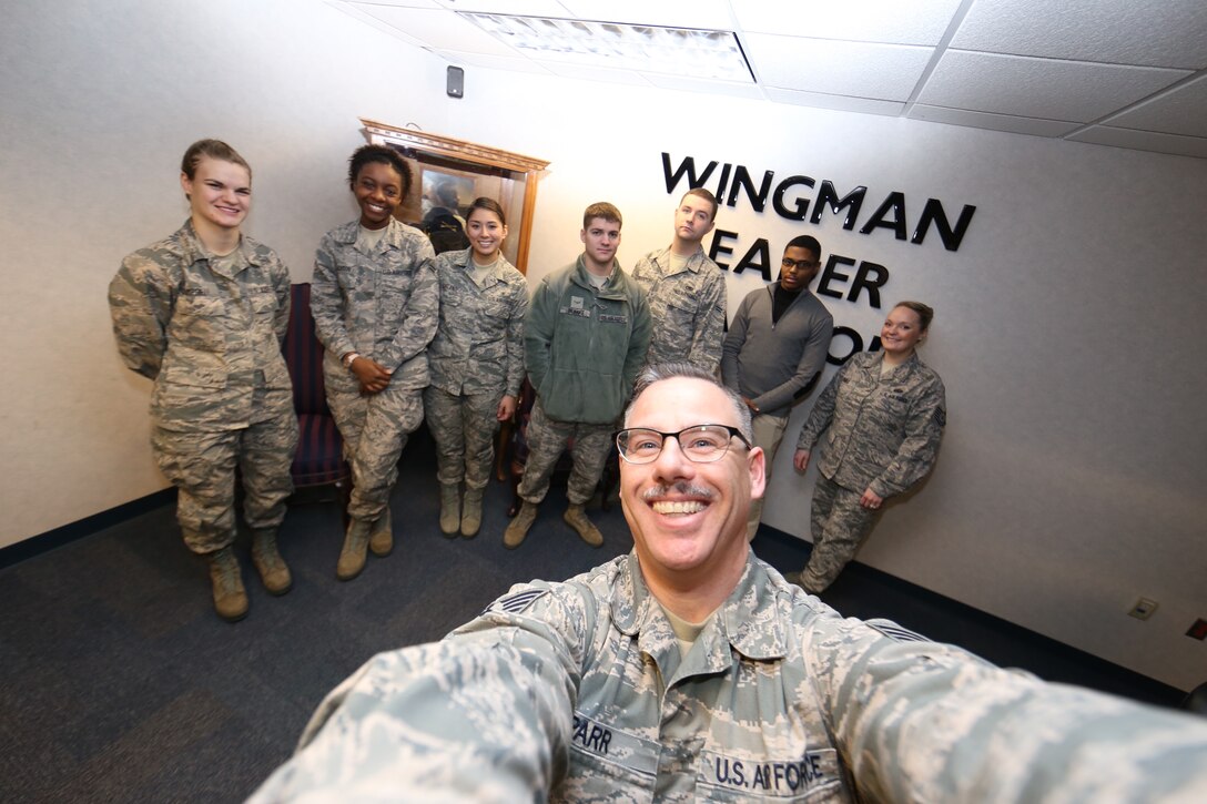 Tech. Sgt. Christopher Parr, public affairs NCOIC, spoke to the brand new group of newcomers in the 932nd Airlift Wing during a welcome briefing and took a moment for a "selfie" photograph to use on the unit's social media page.  He reminds the squadrons that unit public affairs representatives are needed throughout the wing to cover all the news during a year.   (U.S. Air Force photo/Tech. Sgt. Christopher Parr)