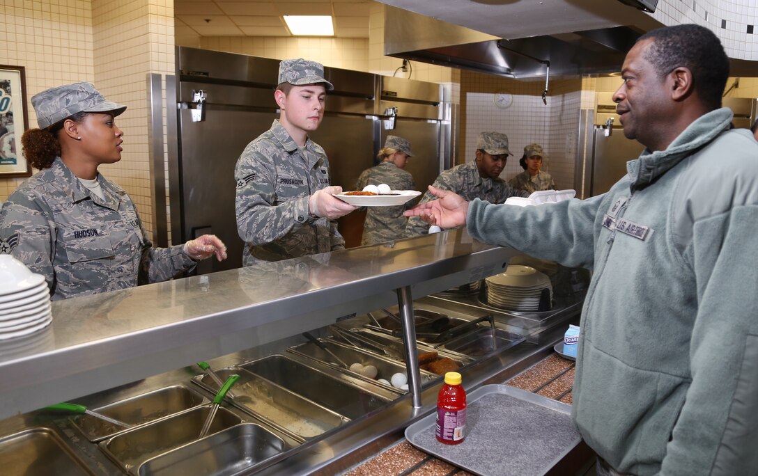 Early morning breakfast is served by the 932nd Services Squadron as Senior Airman Adonna Hudson and Airman First Class Andrew Prusaczyk provide a hot meal to Master Sgt. Ronald James.  (U.S. Air Force photo/Tech. Sgt. Chris Parr)