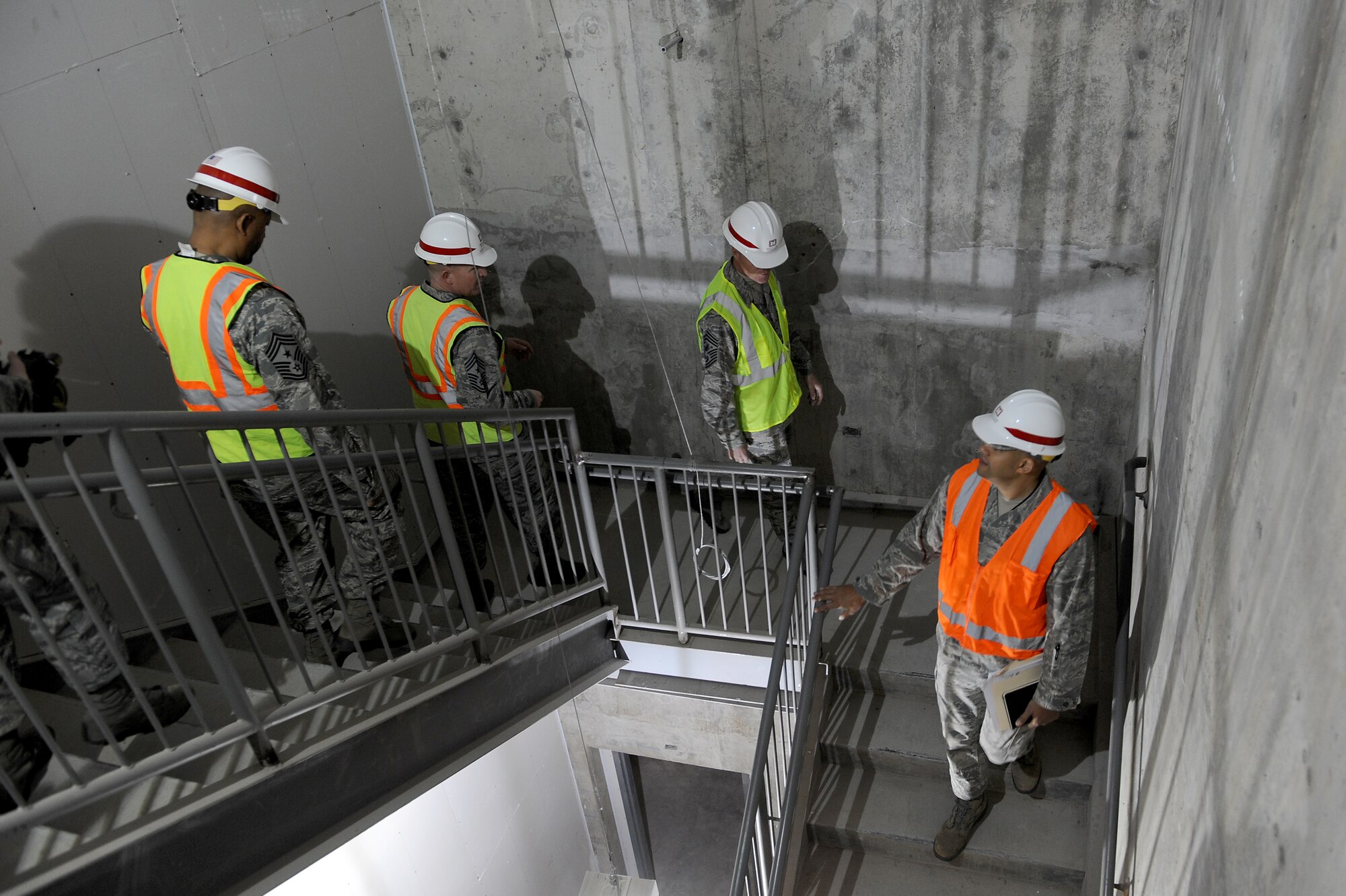 Chief Master Sgt. of the Air Force James Cody is given a tour of the 18th Air Force headquarters building, currently being refurbished, at Scott Air Force Base, Illinois, Jan. 12, 2015. Cody served as the command chief for 18 AF from 2008 to 2010 and talked about his time there during his tour. (U.S. Air Force photo/Staff Sgt. Jonathan Fowler)