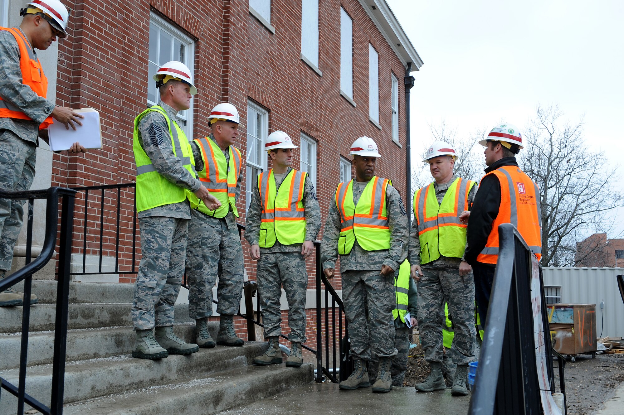 Chief Master Sgt. of the Air Force James Cody is given a safety brief before touring the 18th Air Force headquarters building, currently being refurbished, at Scott Air Force Base, Illinois, Jan. 12, 2014. Cody served as the command chief for 18 AF from 2008 to 2010 and talked about his time there during his tour. (U.S. Air Force photo/Staff Sgt. Jonathan Fowler)