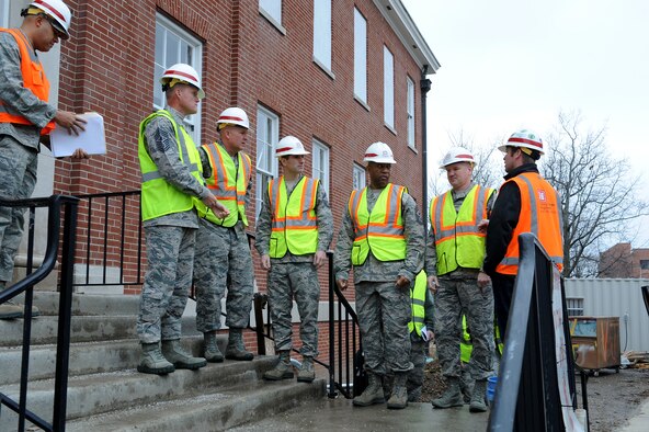 Chief Master Sgt. of the Air Force James Cody is given a safety brief before touring the 18th Air Force headquarters building, currently being refurbished, at Scott Air Force Base, Illinois, Jan. 12, 2014. Cody served as the command chief for 18 AF from 2008 to 2010 and talked about his time there during his tour. (U.S. Air Force photo/Staff Sgt. Jonathan Fowler)