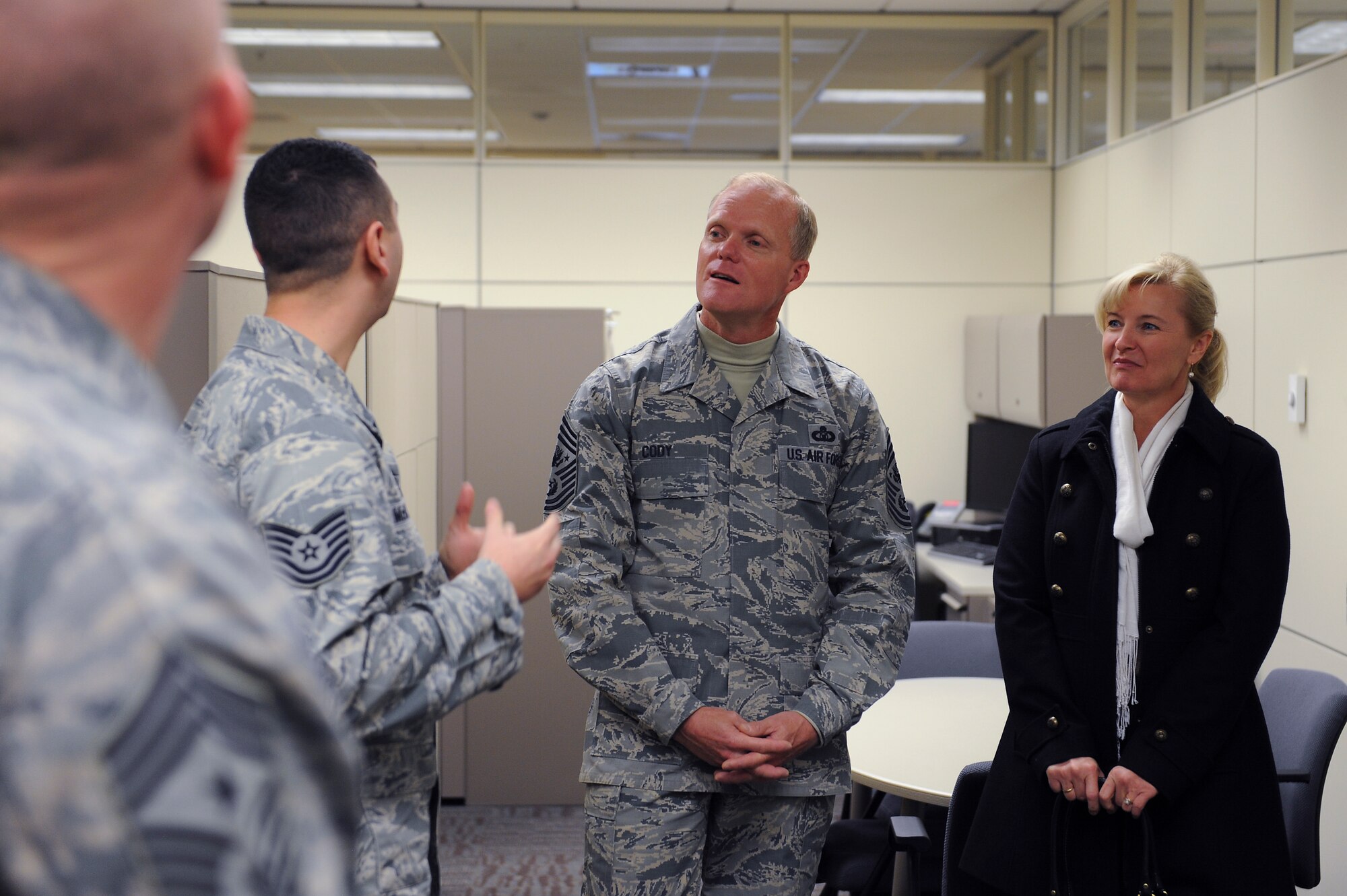Chief Master Sgt. of the Air Force James Cody receives a briefing while visiting many of the units in the 375th Operations Group at Scott Air Force Base, Illinois, Jan. 12, 2015. The visit focused on the benefits of having active duty, guard and reserve working together within a unit and how it improves performance and training effectiveness. (U.S. Air Force photo/Staff Sgt. Jonathan Fowler)