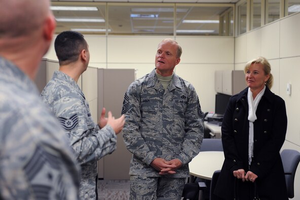 Chief Master Sgt. of the Air Force James Cody receives a briefing while visiting many of the units in the 375th Operations Group at Scott Air Force Base, Illinois, Jan. 12, 2015. The visit focused on the benefits of having active duty, guard and reserve working together within a unit and how it improves performance and training effectiveness. (U.S. Air Force photo/Staff Sgt. Jonathan Fowler)