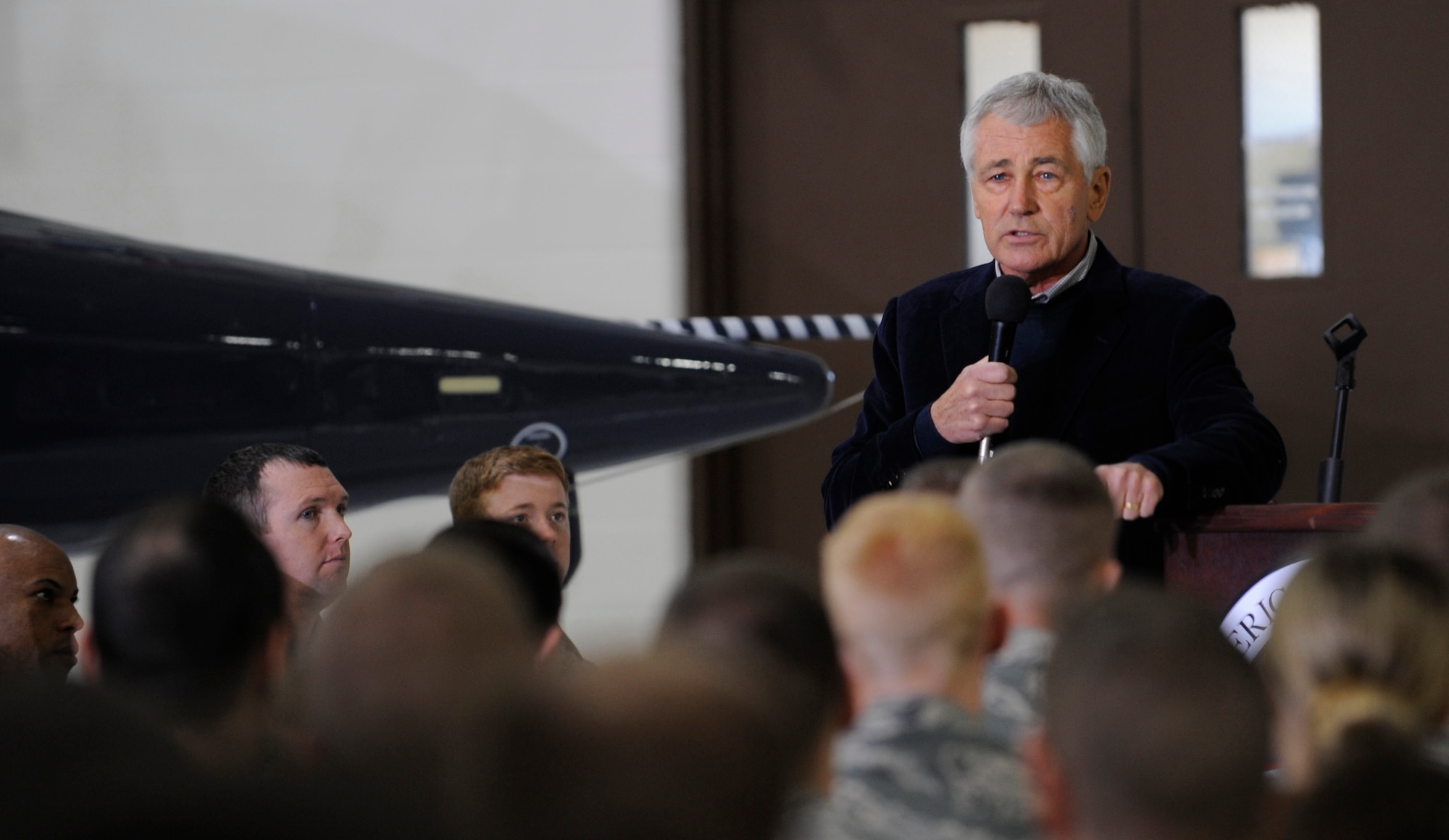 Defense Secretary Chuck Hagel speaks to a few hundred Airmen at Whiteman Air Force Base, Mo., Jan. 13, 2015 during his farewell tour of U.S. military bases. Hagel received a firsthand look at the B-2 Spirit aircraft. His next stop will be visiting with Marine Corps aviators in California. (U.S. Air Force photo by Staff Sgt. Alexandra M. Boutte/Released)