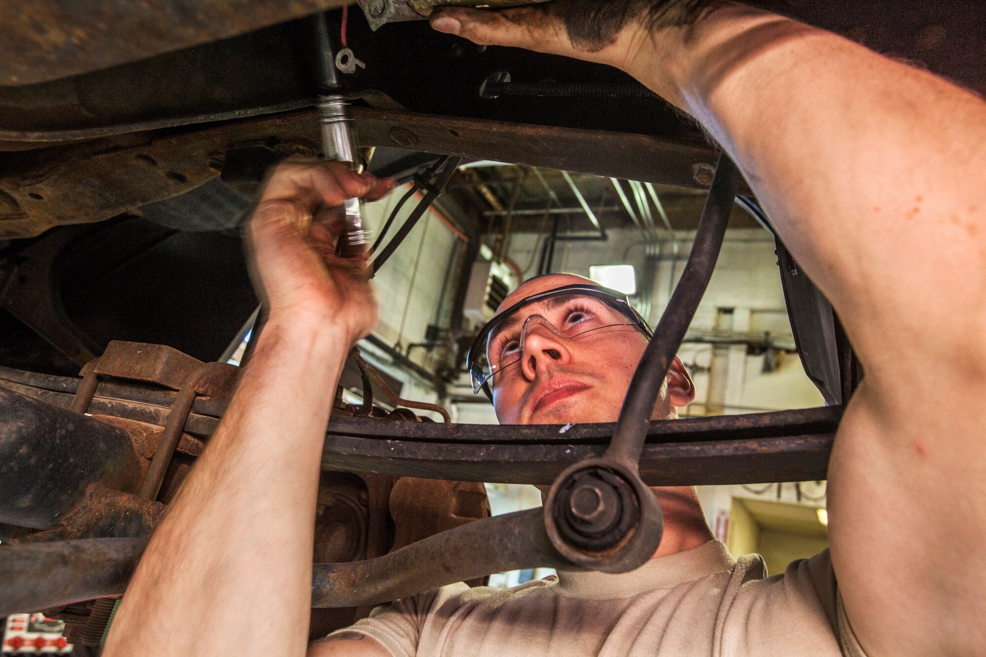 Senior Airman Keith Miller, replaces a starter on a six-passenger pickup truck at the 108th Wing Vehicle Maintenance Shop, New Jersey Air National Guard, Joint Base McGuire-Dix-Lakehurst, N.J., Jan. 11, 2015. (U.S. Air National Guard photo by Master Sgt. Mark C. Olsen/Released)