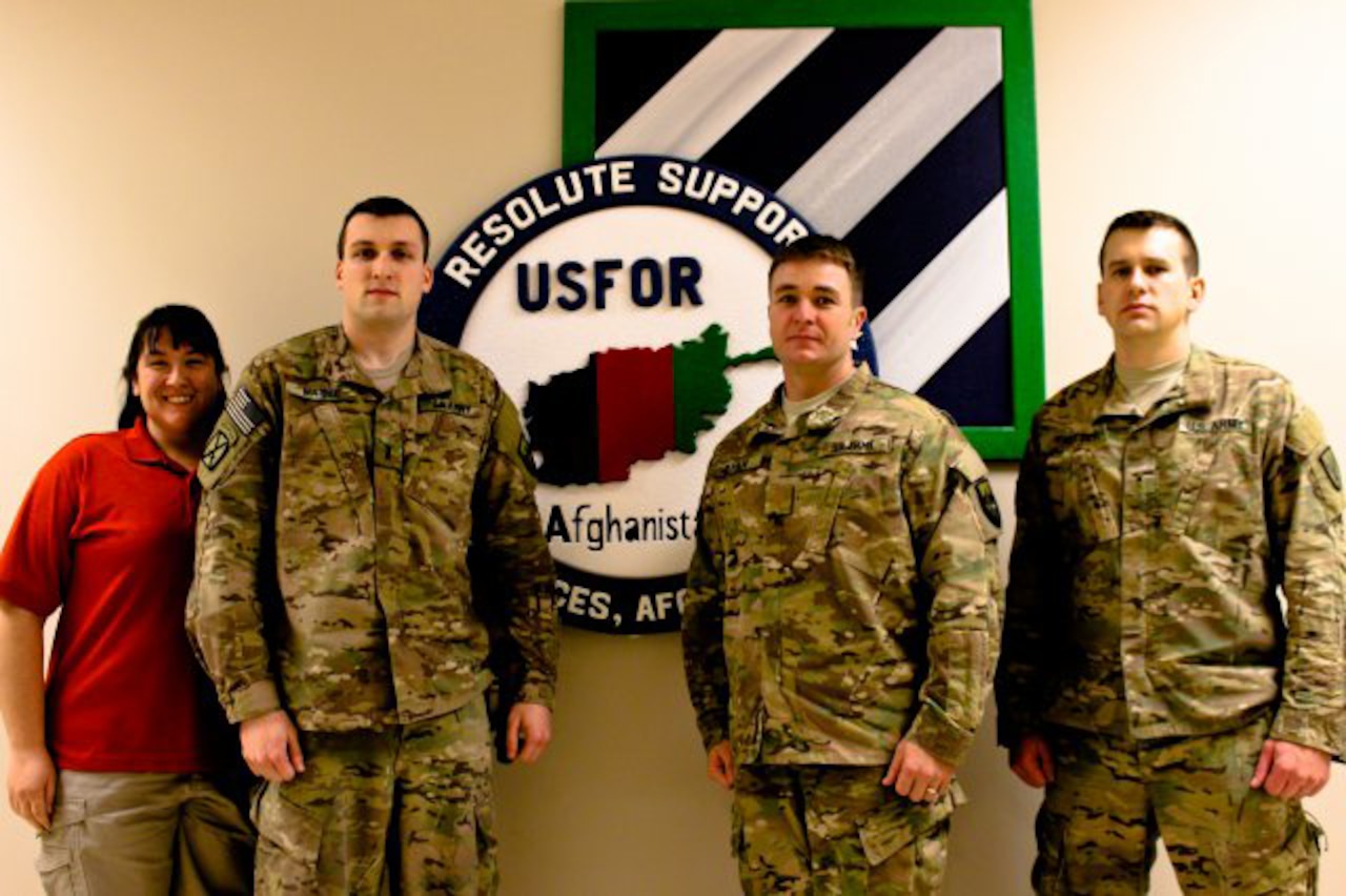 From left to right: Jennifer Kot-Lawton, Army 1st Lt. Adam Maisel, Army Maj. Brian Ryan, and Army Warrant Officer Zachary Ritter worked together to save their coworker’s life when he experienced a recent heart attack while deployed to Bagram Airfield, Afghanistan. U.S. Army Photo by Sgt. 1st Class David Wheeler