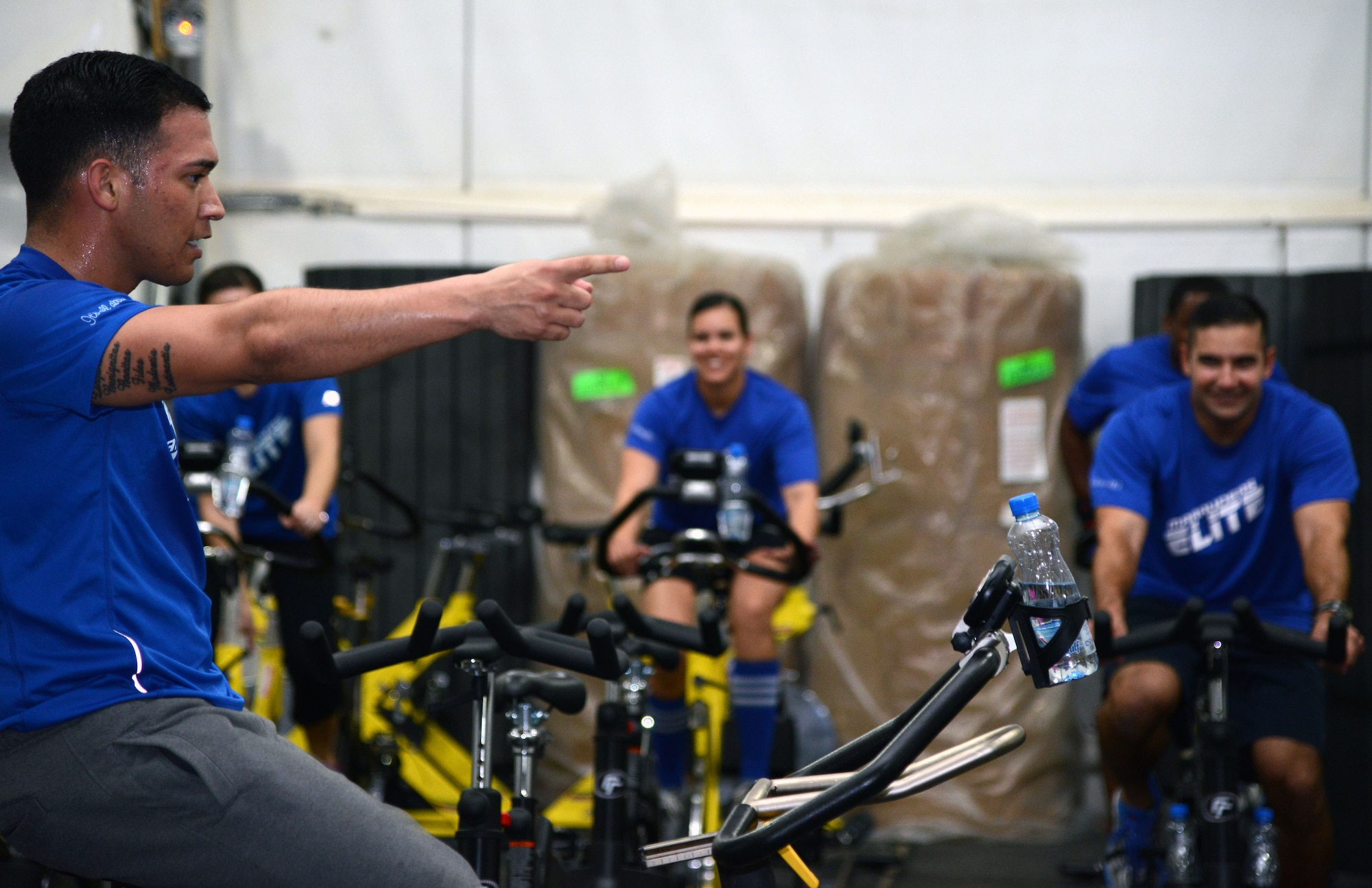 SOUTHWEST ASIA - Senior Airman Joseph Kay, 386th Expeditionary Force Support Squadron, leads a spin class during the Marauders elite reunion workout. The Marauders elite training program is a five-week fitness related education class that teaches attendees how to reach fitness goals safely. (U.S. Air Force photo by Tech. Sgt. Jared Marquis/released)