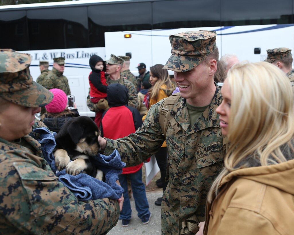 Friends and family members of U.S. Marines with the 26th Marine Expeditionary Unit (MEU) wait for the return of their Marines from deployment at the 26th MEU command post, Camp Lejeune, N.C., Jan. 13, 2015. The Marines were deployed in support of the Special Purpose Marine Air-Ground Task Force Crisis Response-Africa. (U.S. Marine Corps photo by Gunnery Sgt. Andrew D. Pendracki/Released)