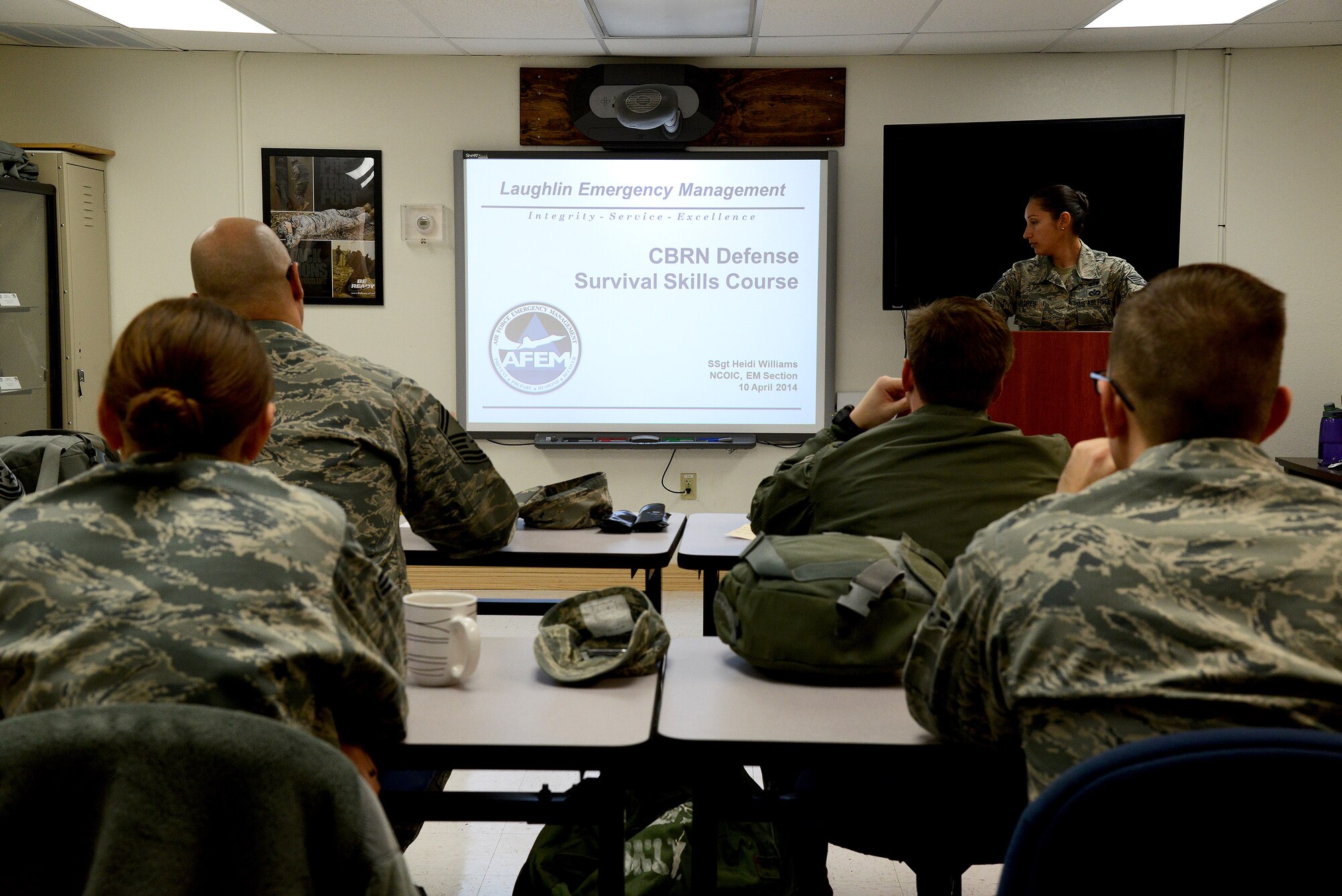 Staff Sgt. Vanessa Flores, 47th Civil Engineer Squadron emergency management craftsman, instructs the chemical, biological, radiological and nuclear survival skills class at the readiness and emergency management flight on Laughlin Air Force Base, Texas, Jan. 14, 2015. Military members are required to complete CBRN training prior to a deployment tasking or when they receive permanent change of station orders to a medium or high-threat area. A computer-based CBRN awareness training is also required for all services members every two years to ensure they are mission-ready. (U.S. Air Force photo by Airman 1st Class Ariel D. Delgado)