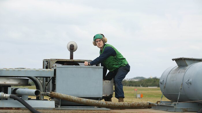 Lance Cpl. Ronald Summerlin prepares to reset equipment following the landing of an FA-18D Hornet Jan. 9 during arrested landing safety training on Marine Corps Air Station Futenma. Arrested landings are the use of equipment, such as a safety barrier or an arresting wire, to rapidly slow down aircraft and ensure the landing path is straight and clear. During the training, Marines demonstrated proficiency in the use of arresting equipment while ensuring the safety of personnel and equipment on the airstrip. Summerlin is a Virginia Beach, Virginia, native and an expeditionary airfield systems technician with Headquarters and Headquarters Squadron, MCAS Futenma, Marine Corps Installations Pacific-Marine Corps Base Camp Butler, Japan. 