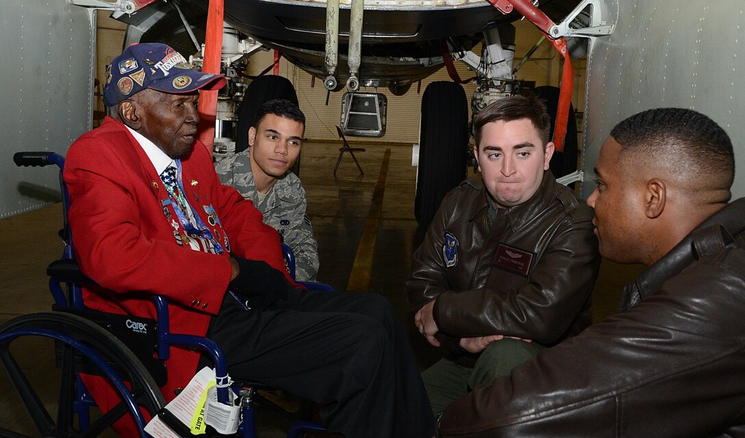 Calvin Spann, a Tuskegee Airman, speaks with Maj. Matthew Millard, right, 11th Bomb Squadron, inside the bomb bay of a B-52H Stratofortress during a visit to Barksdale Air Force Base, La., Dec. 27, 2014. Spann, a Lieutenant in the Army Air Corps, would serve in Italy during World War II, where he was a P-51 Mustang pilot and flew in 26 combat missions. (U.S. Air Force photo/Senior Airman Benjamin Gonsier)