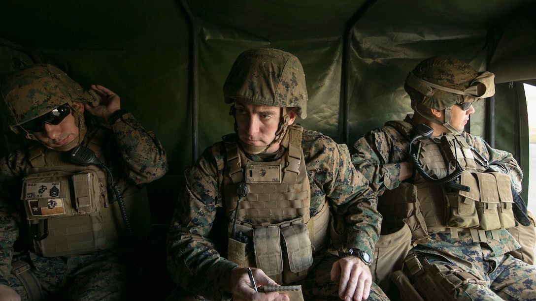 1st Lt. William Tidd, center, from Angola, Indiana, confers with other members of the Humanitarian Assistance Survey Team after responding to a natural disaster scenario Jan. 13 at Camp Hansen. The HAST responds to areas that have been struck by natural disasters and determine how much supply and resources are required to assist the affected area. Tidd is the assistant officer in charge of the HAST, Combat Logistics Battalion 31, 31st Marine Expeditionary Unit. 