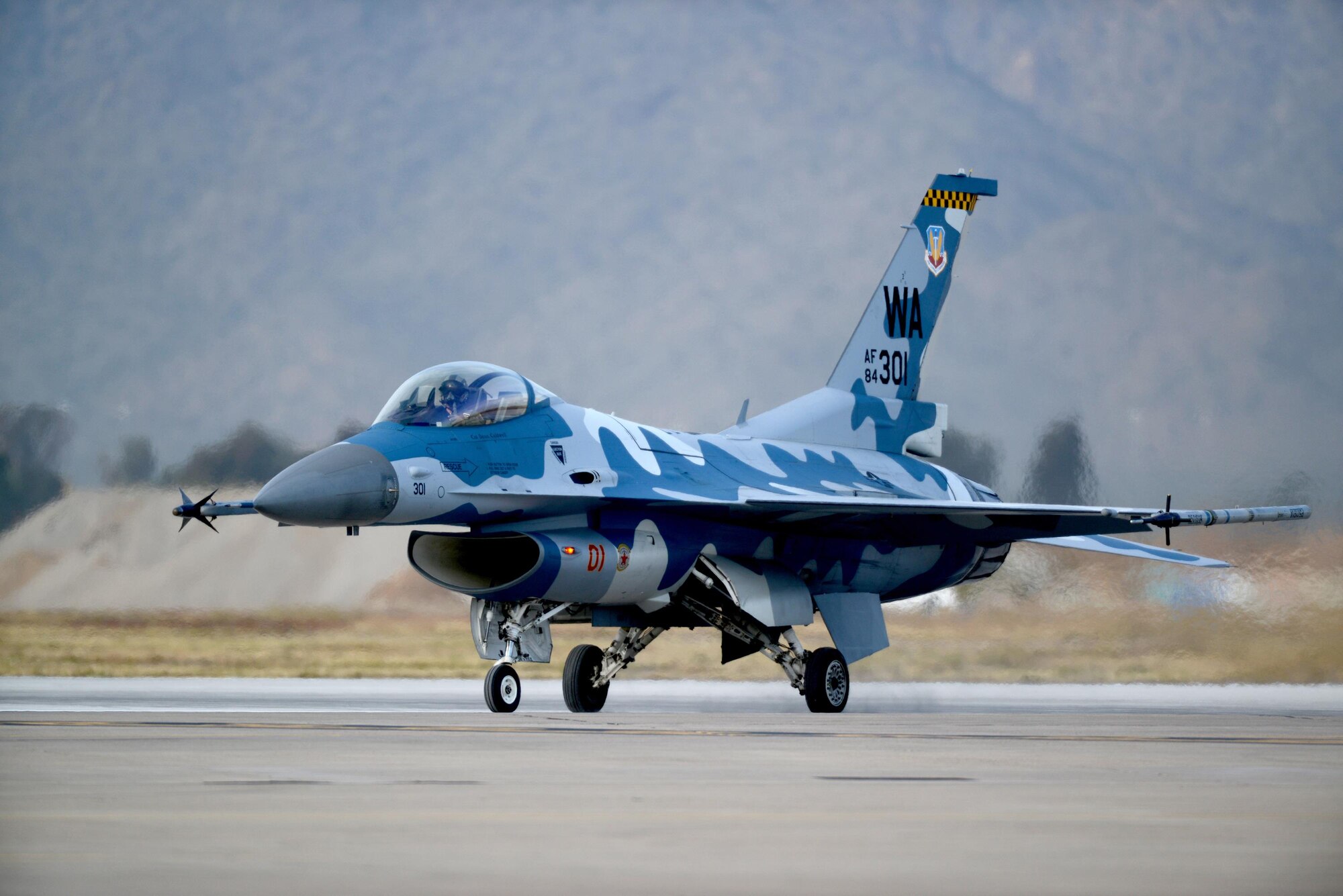 The 64th Aggressor Squadron, Nellis Air Force Base, Nevada, came to Luke Air Force Base last week for eight days of dissimilar air combat training to aid students from the 308th and 309th fighter squadrons with flight training and academics. Their expertise and specialized skills in replicating enemy aircraft tactics provided the students with in depth knowledge and analysis on adversary systems and tactics. (U.S. Air Force photo/Staff Sgt. Timothy Boyer)