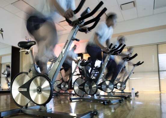 Airmen from the 71st Comptroller Squadron dig deep for physical training at the Bradley Fitness and Sports Center here, Jan. 16. Bradley offers Team Vance intramural and varsity sports, exercise incentive programs, group exercise classes, special fitness events, a variety of cardiovascular and strength training equipment, and numerous health, wellness and fitness programs. (U.S. Air Force photo / David Poe)