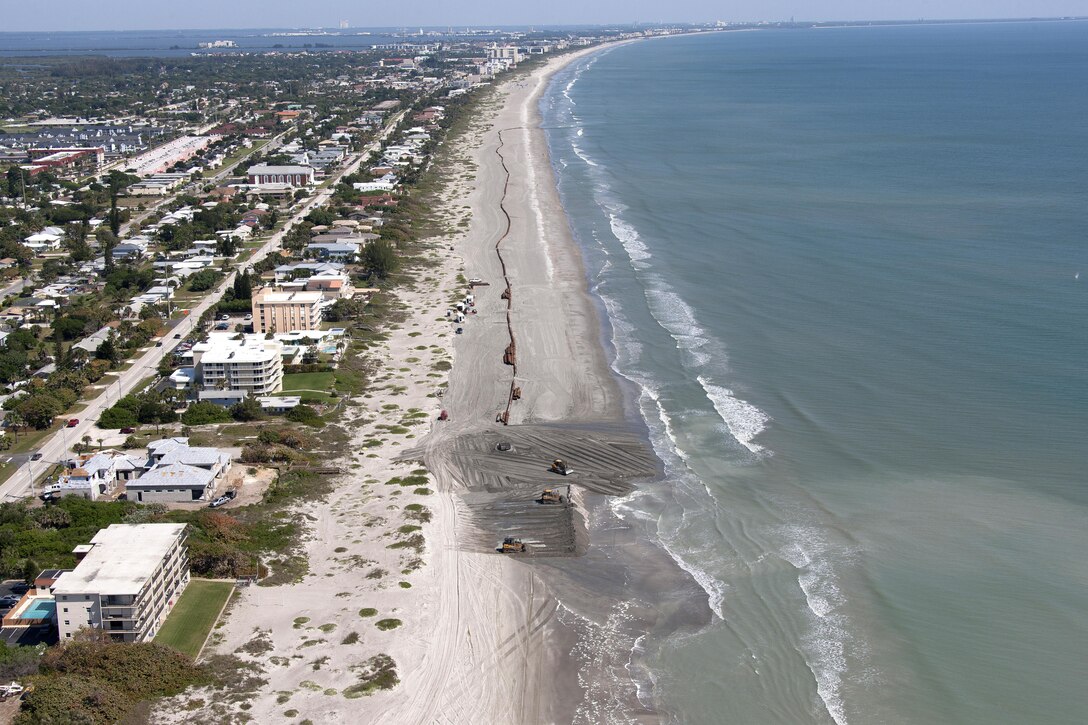 Contractors pump sand onto miles of Brevard County beaches. 