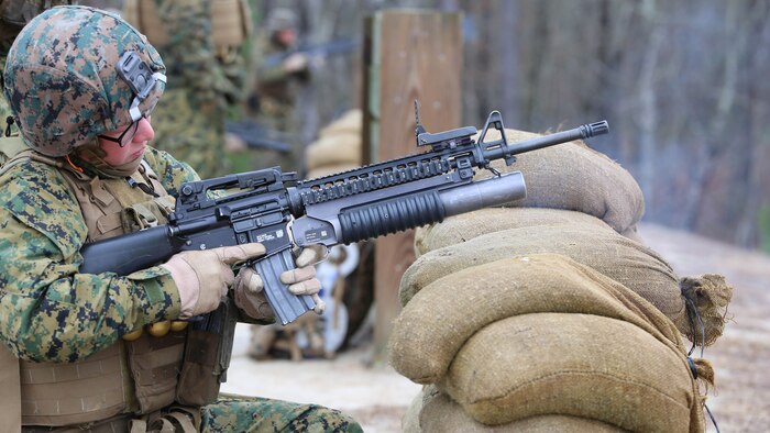 Cpl. Sierra K. Tilson, rifleman with 3rd Platoon, Company A, Ground Combat Element Integrated Task Force, fires the M203 grenade launcher during a live-fire range at the Verona Loop training area, near Marine Corps Base Camp Lejeune, North Carolina, Jan. 14, 2015. Marines with Co. A conducted live-fire training, squad attacks, and patrolling in preparation for their upcoming assessment at Marine Corps Air Ground Combat Center Twentynine Palms, California. From October 2014 to July 2015, the GCEITF will conduct individual and collective level skills training in designated ground combat arms occupational specialties in order to facilitate the standards based assessment of the physical performance of Marines in a simulated operating environment performing specific ground combat arms tasks. 