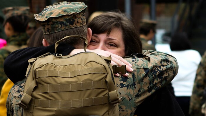 Friends and family members of U.S. Marines with the 26th Marine Expeditionary Unit  wait for the return of their Marines from deployment at the 26th MEU command post, Camp Lejeune, N.C., Jan. 13, 2015. The Marines were deployed in support of the Special Purpose Marine Air-Ground Task Force Crisis Response Africa. 