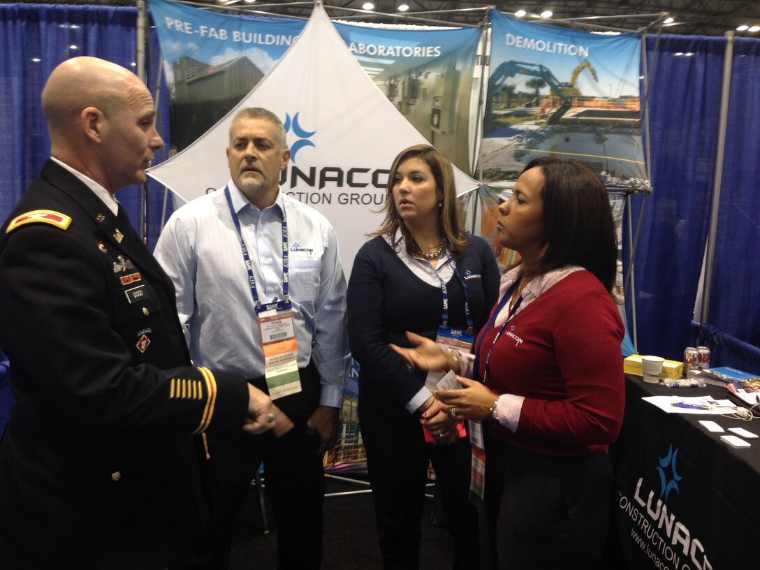 Col. alan Dodd reaches out to attendees at the annual Society of American Military Engineers' 2014 Small Business Conference in Kansas City, Missouri