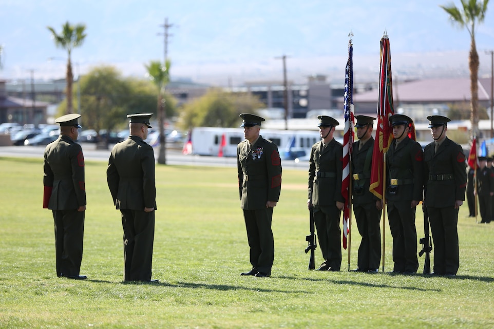 Sgt. Maj. Chasen E. Getty, former battalion sergeant major, 1st Battalion, 7th Marine Regiment, stands in front of Sgt. Maj. Michael Cedeno, battalion sergeant major, 1/7, and Lt. Col. David J. Hart, battalion commander, 1/7, during the relief and appointment ceremony for 1/7 at Lance Cpl. Torrey L. Gray Field, Jan. 9, 2015. (Official Marine Corps photo by Lance Cpl. Julio McGraw/Released)