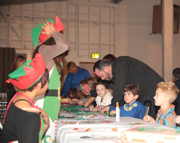 Children create arts and crafts during the Bob Hope United Service Organization, Palm Springs sponsored Robert E. Bush Naval Hospital holiday party at Smith Ranch, Dec. 11, 2014. This is the third consecutive year that the Bob Hope USO, Palm Springs has sponsored the holiday party. (Official Marine Corps photo by Lance Cpl. Medina Ayala-Lo/Released)
