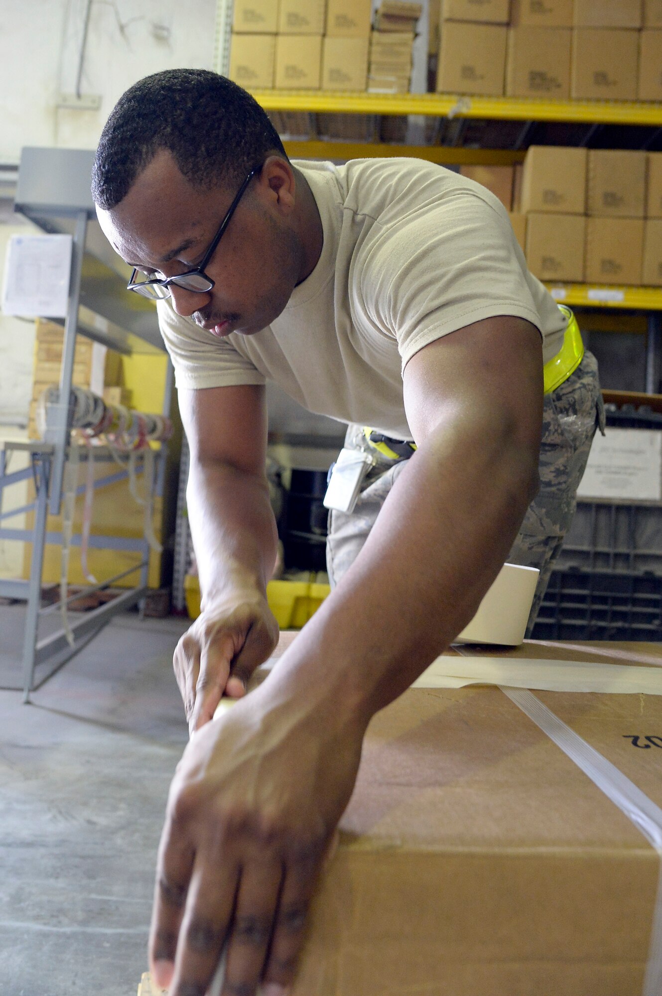 Staff Sgt. Devonshon, outbound cargo supervisor, prepares assets for shipment at an undisclosed location in Southwest Asia Jan. 13, 2015. The TMO inbound and outbound team works 24-hours a day, seven days a week moving cargo and passengers anywhere, anytime. Devonshon is currently deployed from Luke Air Force Base, Ariz., and is a native of Oxnard, Calif. (U.S. Air Force photo/Tech. Sgt. Marie Brown)
