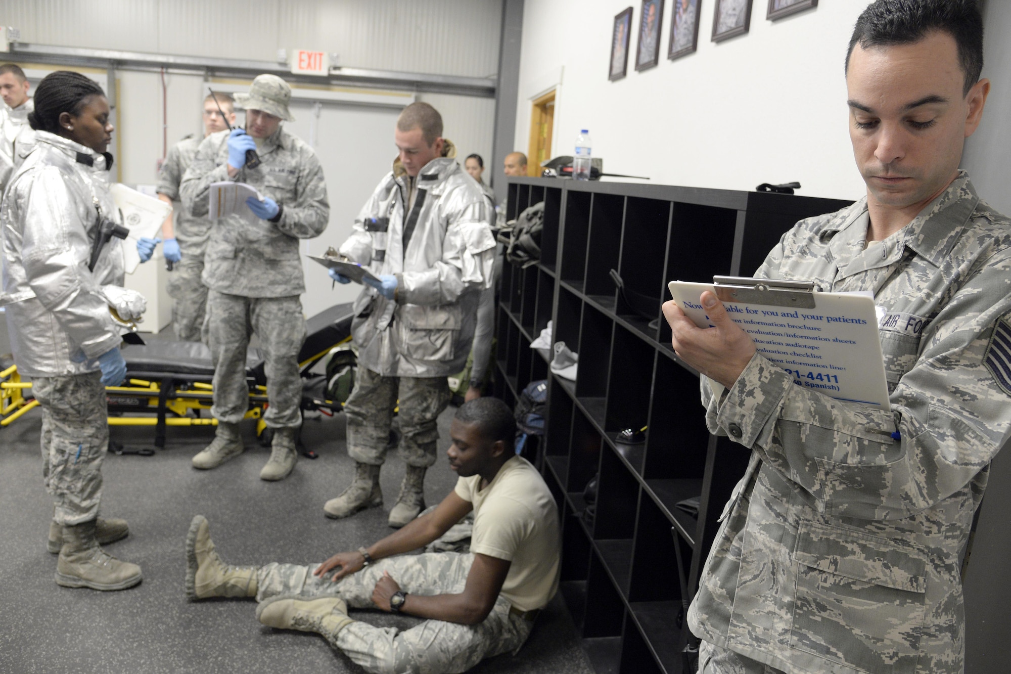 Tech. Sgt. Richard, wing inspection team member, evaluates first responders during a training exercise at an undisclosed location in Southwest Asia Jan. 15, 2015. Participants were evaluated and rated as minor, critical or significant with respect to mission impact. Richard is currently deployed from Joint Base McGuire-Dix-Lakehurst, N.J., and is a native of Olympia, Wash. (U.S. Air Force photo/Tech. Sgt. Marie Brown)