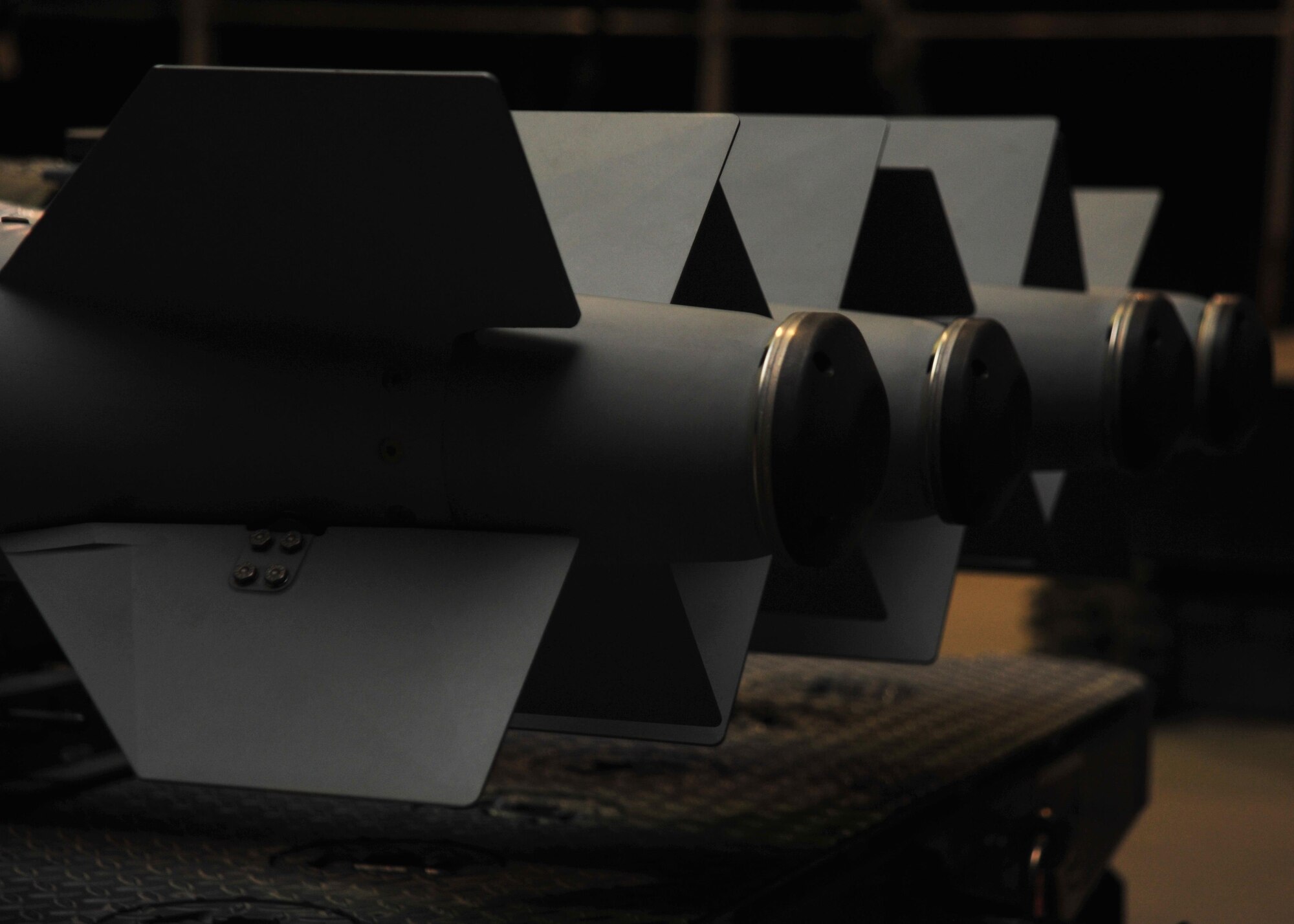 Munitions, secured to a trailer by Airmen assigned to the 455th Expeditionary Maintenance Squadron line delivery crew, are prepared for transportation to the flightline Jan. 14, 2015 at Bagram Airfield, Afghanistan. Line delivery Airmen have completed 741 munitions deliveries since October, ensuring the timely facilitation of airpower to the U.S. Central Command area of responsibility. (U.S. Air Force photo by Staff Sgt. Whitney Amstutz/released)