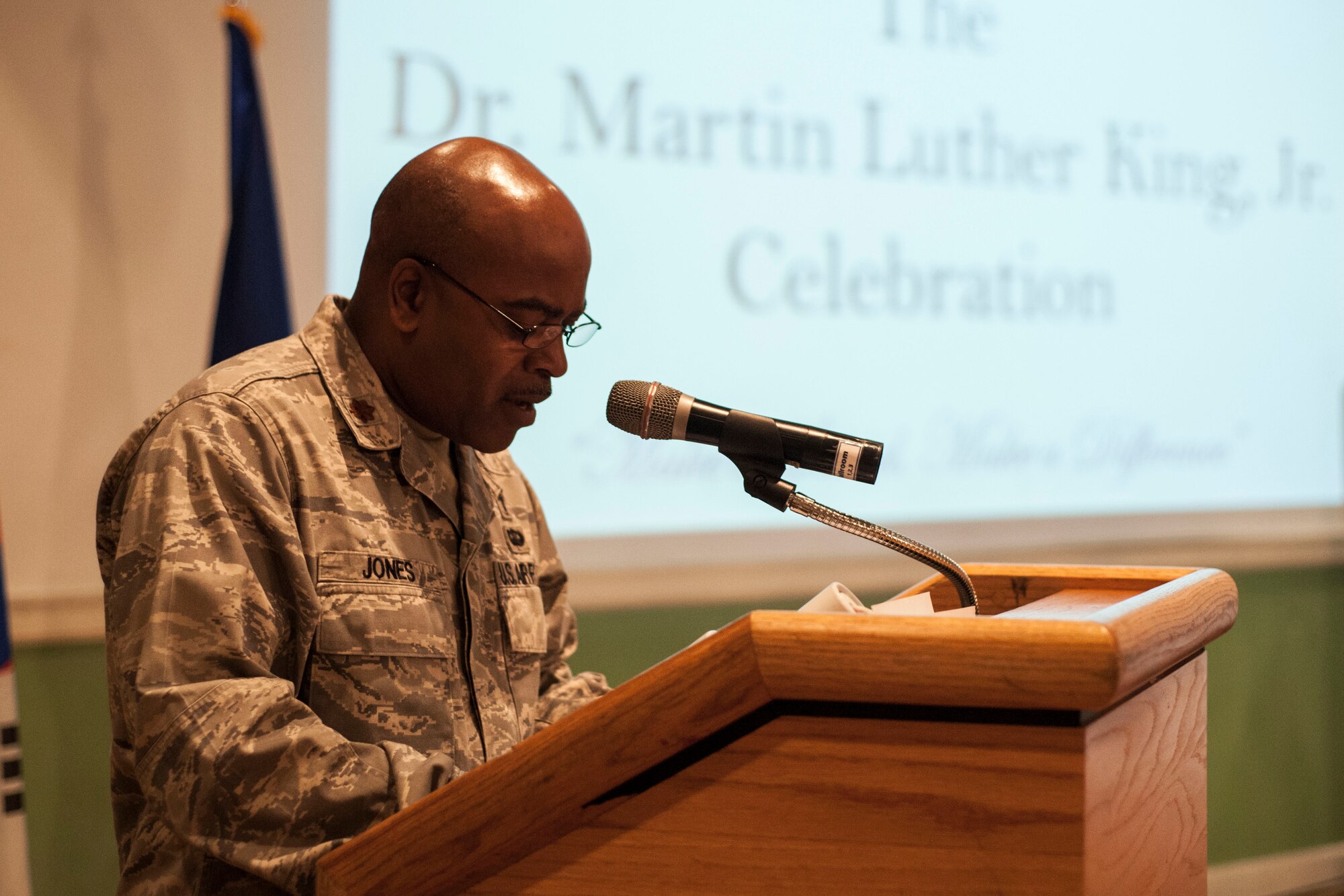 Chaplain (Maj.) Dwayne Jones, 8th Fighter Wing chaplain, provides an invocation during a Martin Luther King Jr. Day luncheon Jan. 16, 2015, at Kunsan Air Base, Republic of Korea. More than 50 Wolf Pack Airmen paid homage to the historical impact of American civil rights activist Dr. King. (U.S. Air Force photo by Senior Airman Katrina Heikkinen/Released)