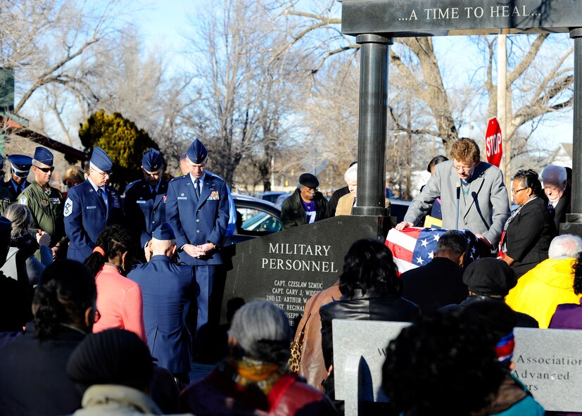Leadership from McConnell Air Force Base and members of the Wichita, Kan., community bow their heads during a moment of prayer at a remembrance ceremony, Jan. 16, 2015, at Piatt Memorial Park, Wichita, Kan. The ceremony was held to honor the 30 people who perished when a KC-135A Stratotanker crashed shortly after take-off on Jan. 16, 1965. (U.S. Air Force photo/Ashley M. Wright)