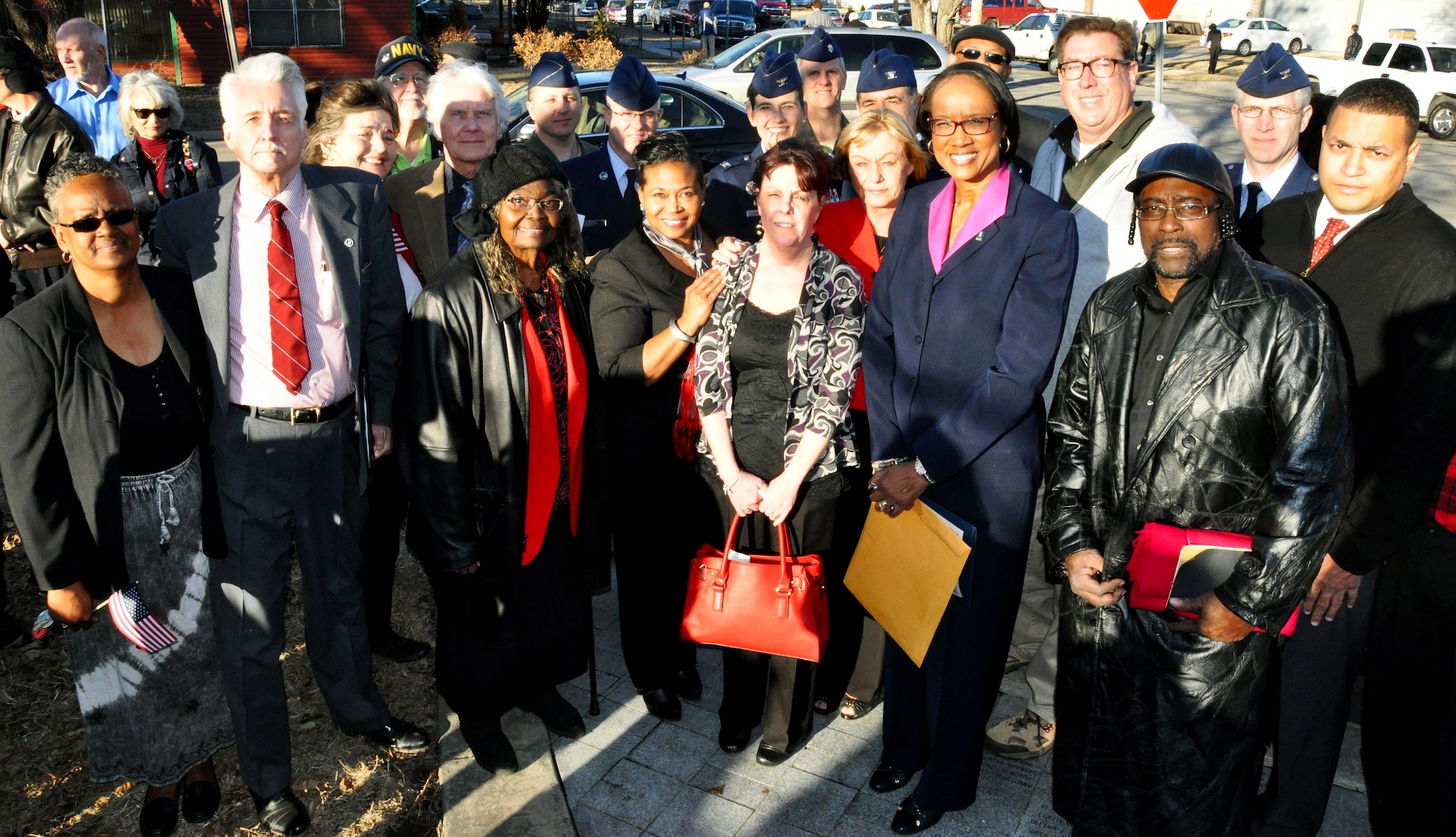 Leadership from McConnell Air Force Base and members of the Wichita, Kan., community pose after a remembrance ceremony, Jan. 16, 2015, at Piatt Memorial Park, Wichita, Kan. The ceremony was held to honor the 30 people who perished when a KC-135A Stratotanker crashed shortly after take-off on Jan. 16, 1965. (U.S. Air Force photo/Capt. Zach Anderson)