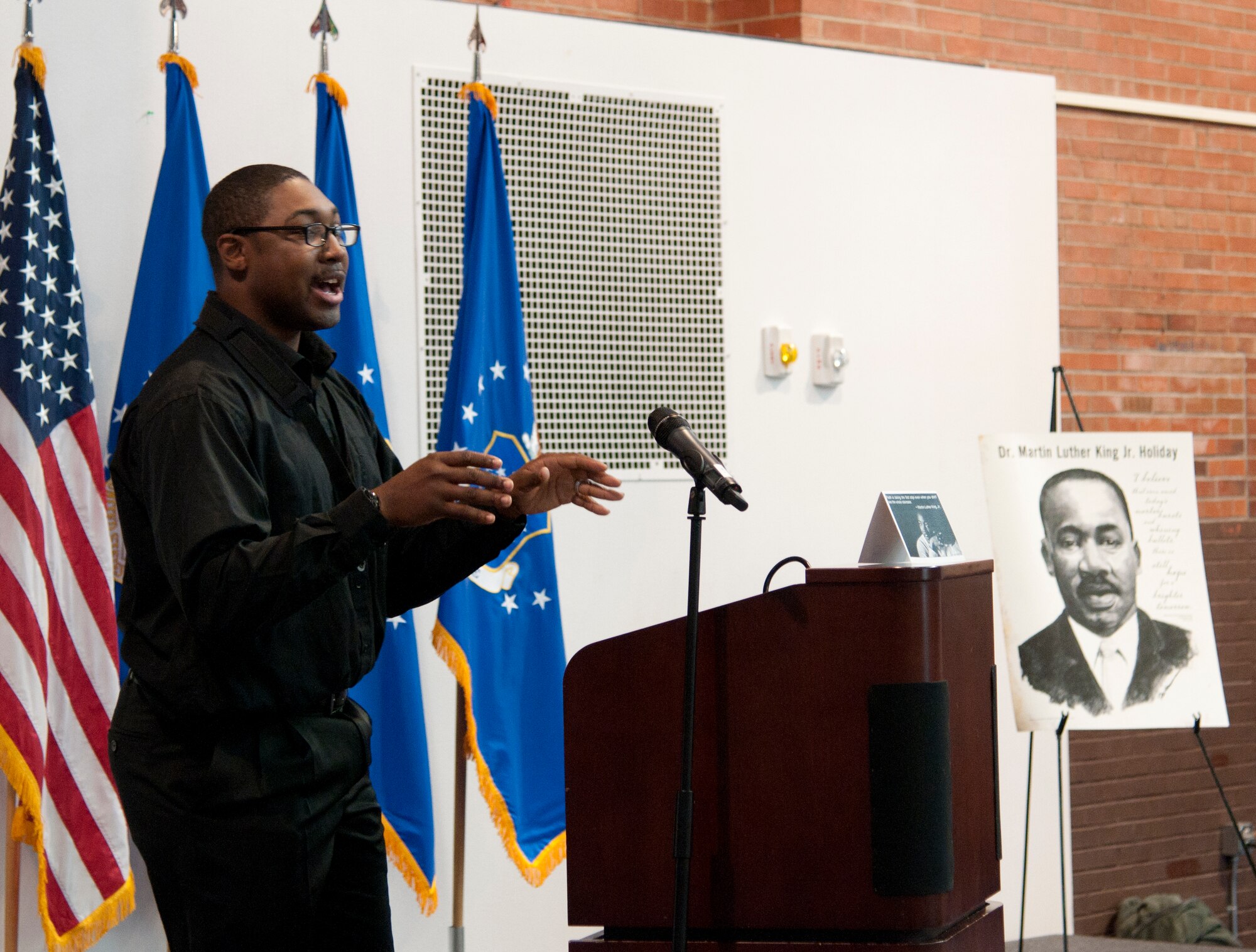 Staff Sgt. Christopher Banks, 90th Security Forces Squadron Military Working Dogs Section, discusses his perspective on the life and legacy of Dr. Martin Luther King, Jr., during a remembrance luncheon in the Fall Hall Community Center on F.E. Warren Air Force Base, Wyo., Jan 15, 2015. Airmen from the 90th Missile Wing and people from the local community attended the luncheon to remember the legacy of King. (U.S. Air Force photo by Senior Airman Jason Wiese)