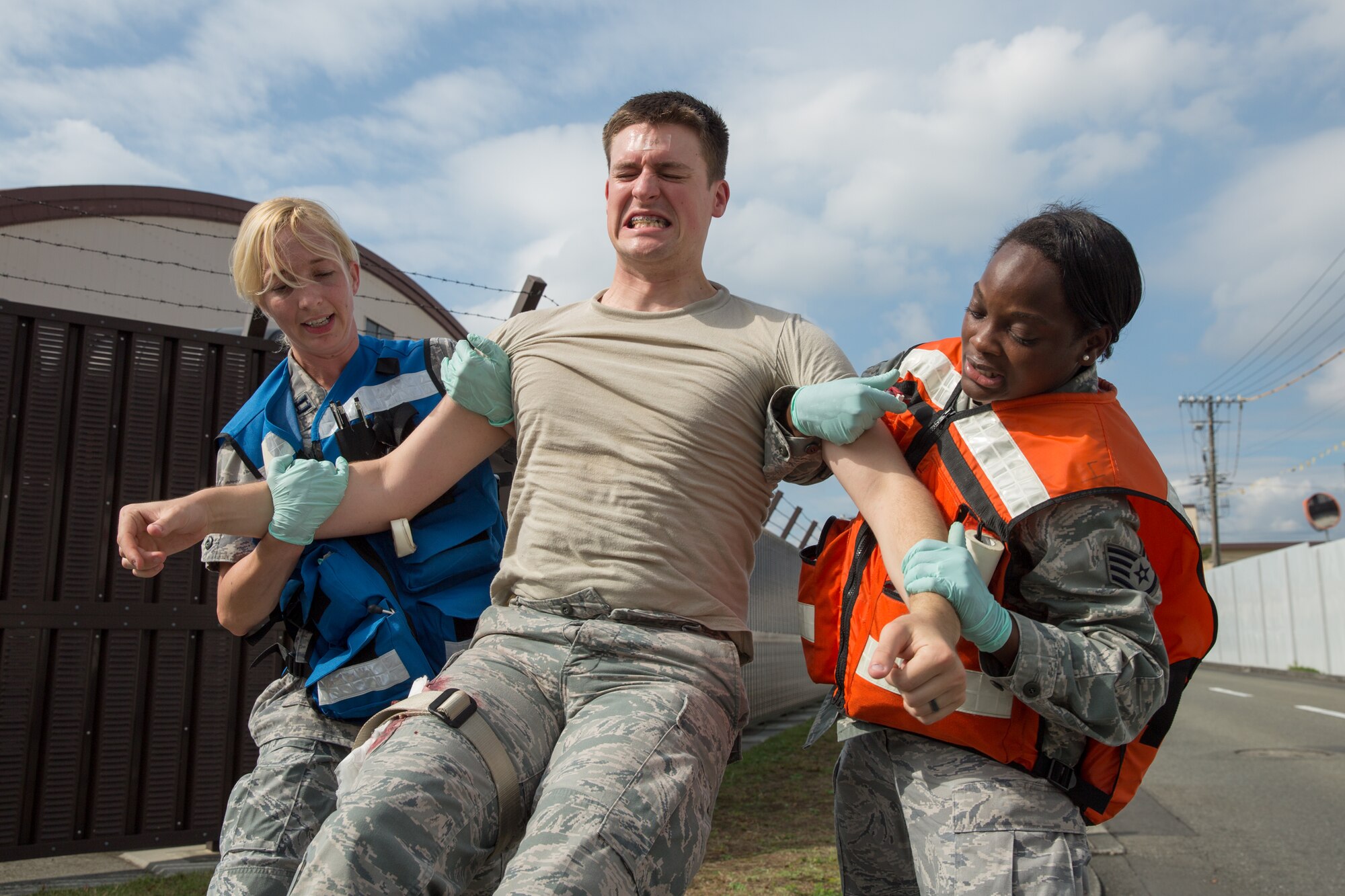 (From left to right) Capt. Rebecca Cupp, 374th Aerospace Medicine Squadron, and Staff Sgt. Raven Taylor, 374th Surgical Operations Squadron, transport a simulated injured victim during an active shooter scenario at Yokota Air Base, Japan, Oct. 10, 2013. Throughout her career, Taylor has stood out amongst her peers as a superior performer. She was selected for promotion to senior airman below the zone and achieved the rank of staff sergeant her first time testing. (U.S. Air Force photo by Osakabe Yasuo/Released)