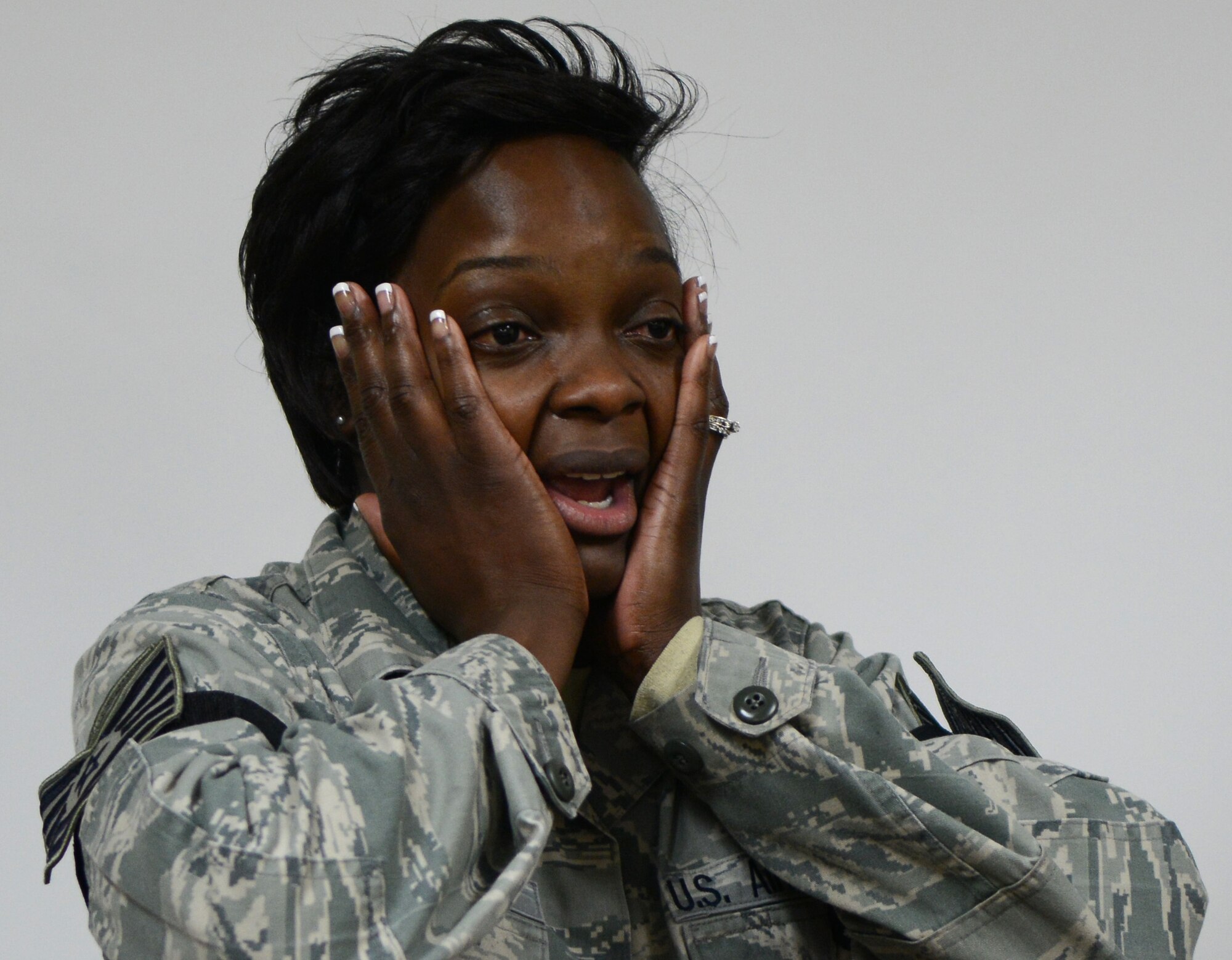 Tech. Sgt. Raven Taylor, 7th Medical Operations Squadron medical technician, shows excitement after being promoted through the Stripes for Exceptional Performers (STEP) program Dec. 22, 2014, at Dyess Air Force Base, Texas. STEP is a program that gives commanders the ability to promote Airmen to the rank of staff sergeant, technical sergeant and master sergeant if they exhibit exceptional potential. (U.S. Air Force photo by Airman 1st Class Kedesha Pennant/Released)