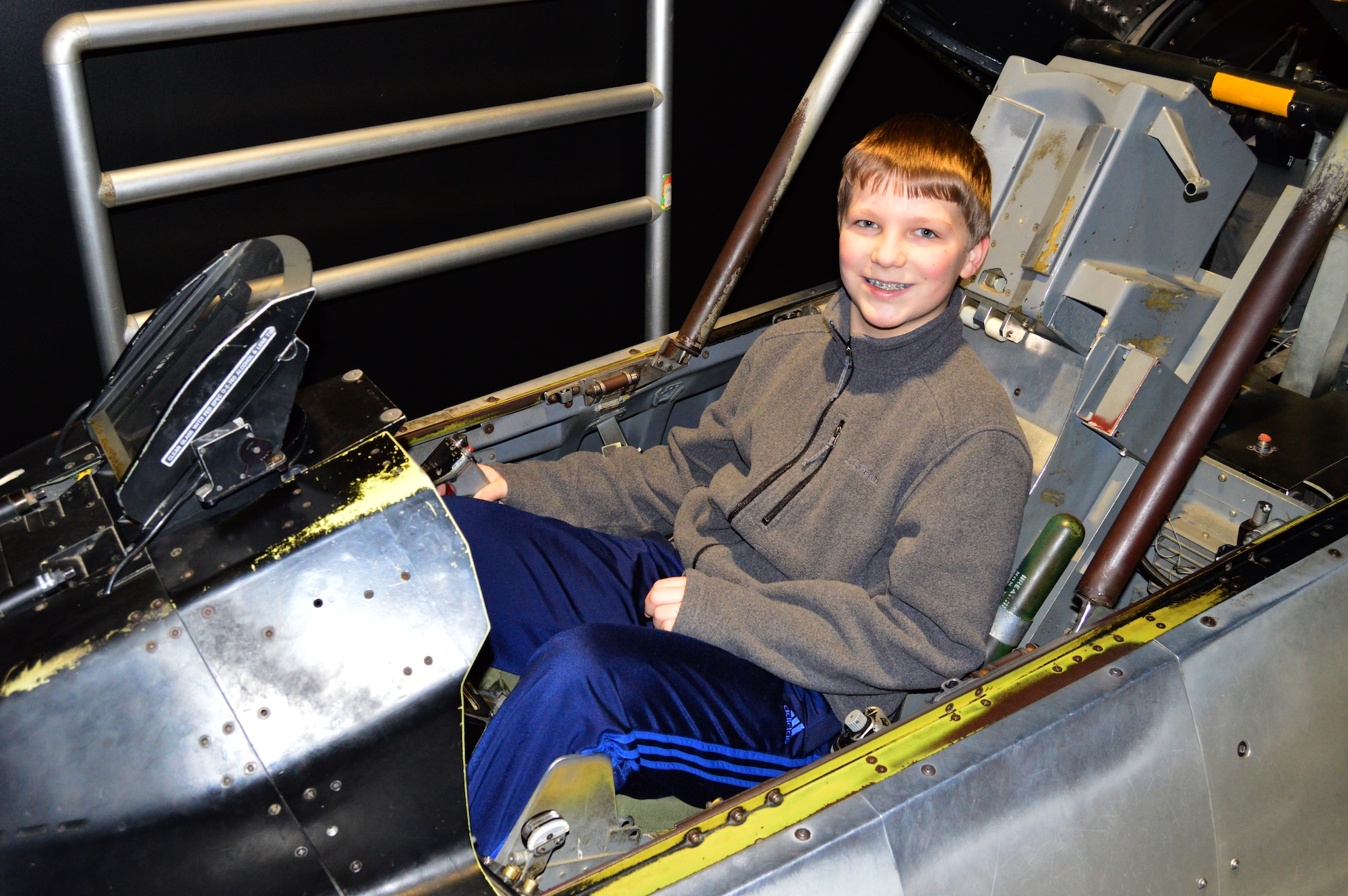 DAYTON, Ohio - A museum visitor enjoying the F-16 Sit-in Cockpit in the Cold War Gallery at the National Museum of the U.S. Air Force. (U.S. Air Force photo)
