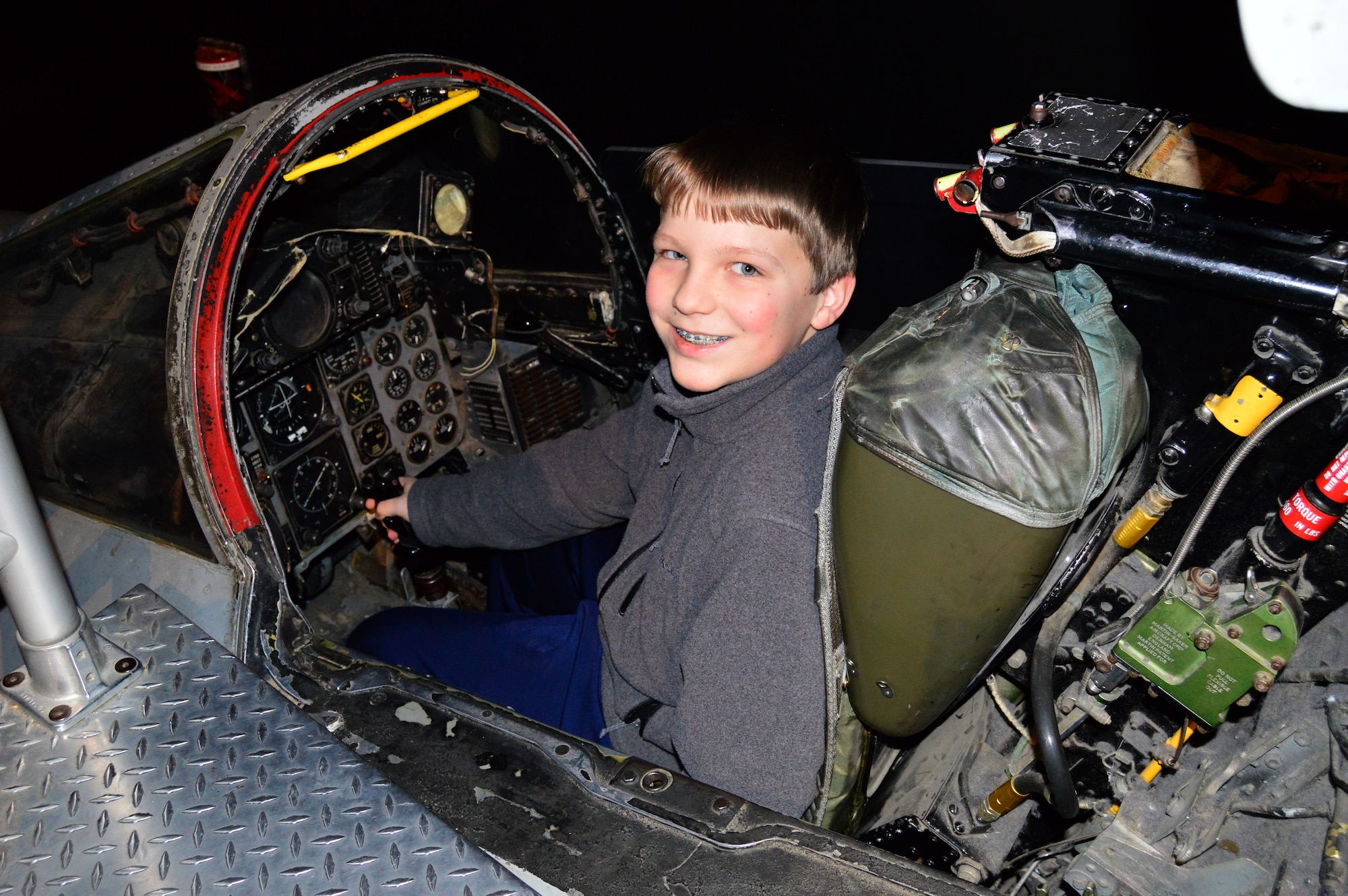 DAYTON, Ohio - A museum visitor enjoying the F-4D Phantom II Sit-in Cockpit in the Cold War Gallery at the National Museum of the U.S. Air Force. (U.S. Air Force photo)
