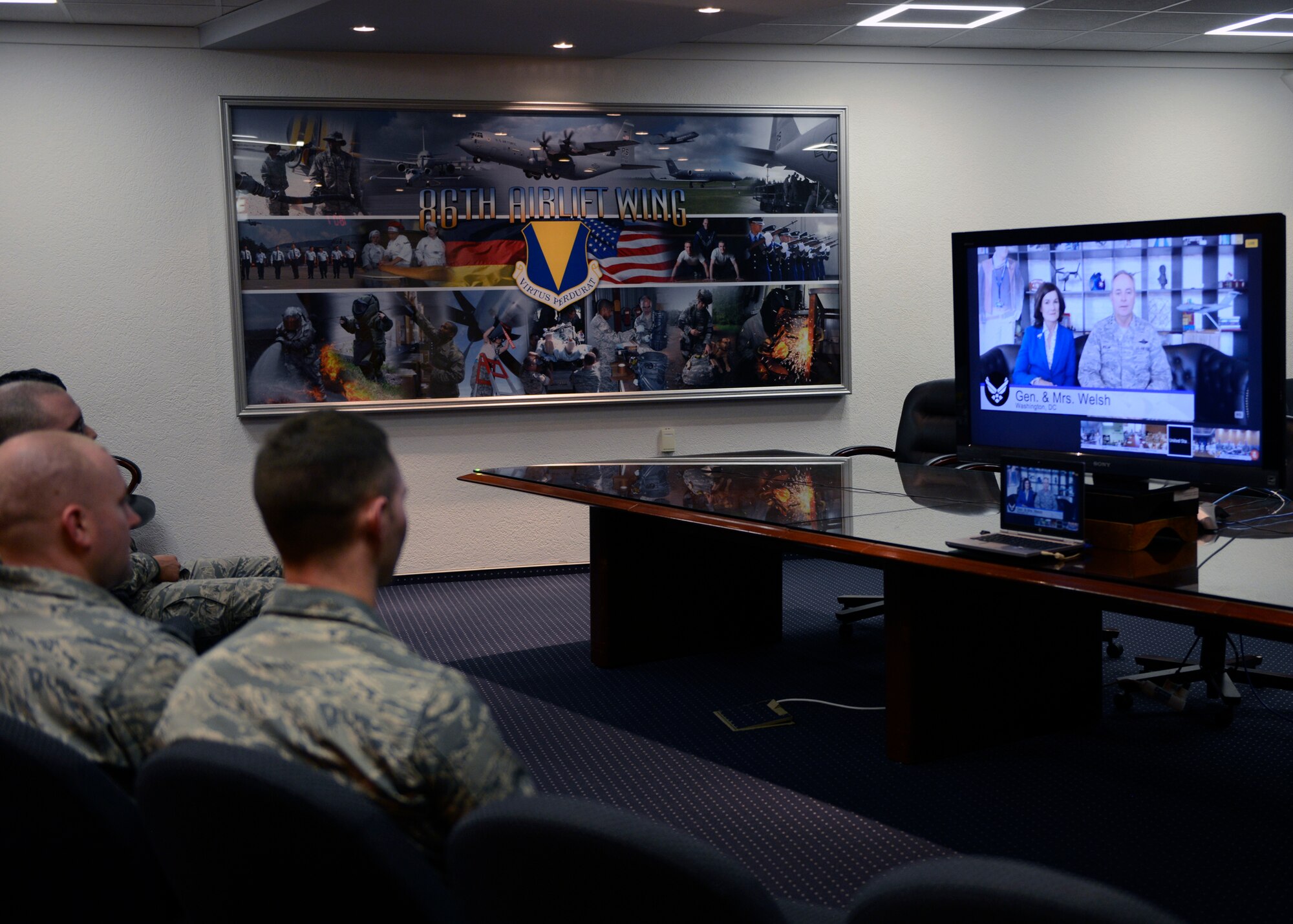 Airmen from Ramstein Air Base, Germany listen to the Chief of Staff of the Air Force, Gen. Mark A. Welsh III, respond to questions during a video conference Jan. 16, 2015. The video conference allowed Airmen to chat with Welsh about Air Force topics in an informal setting. (U.S. Air Force photo/Staff Sgt. Kris Levasseur)